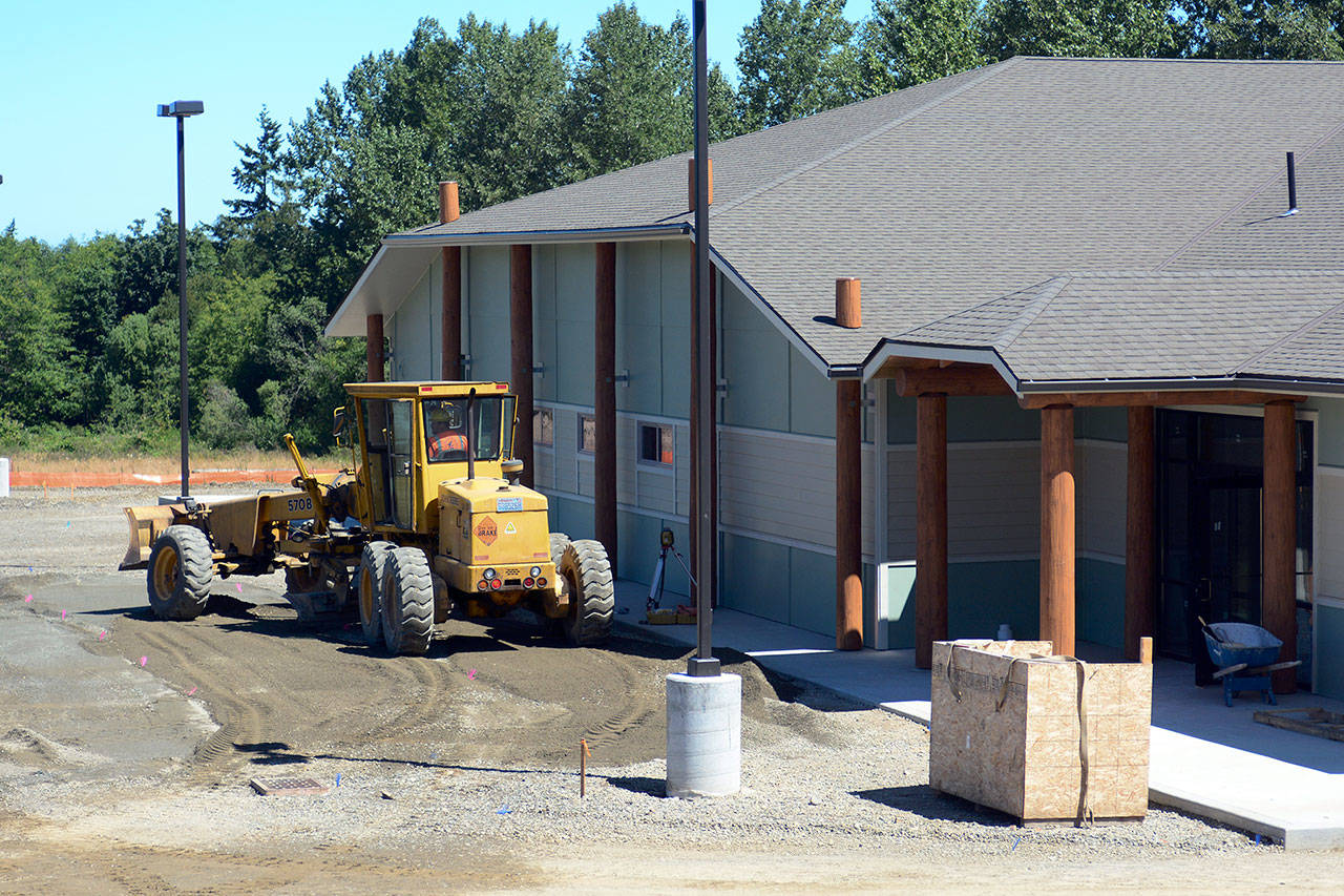 Work continues Tuesday on the Lower Elwha Klallam Tribe’s new building, which will begin housing Klallam Counseling Services in August. (Jesse Major/Peninsula Daily News)