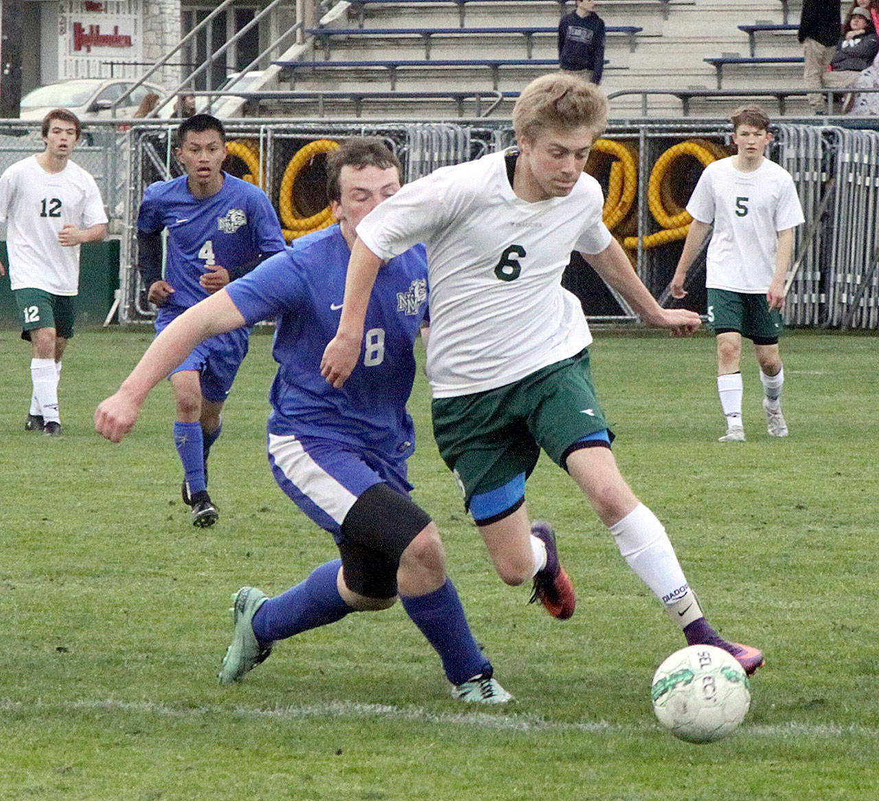 Port Angeles’ Ben Schneider dribbles past a North Mason player. Schneider has been selected as the All-Peninsula Boys Soccer MVP.                                Keith Thorpe/Peninsula Daily News