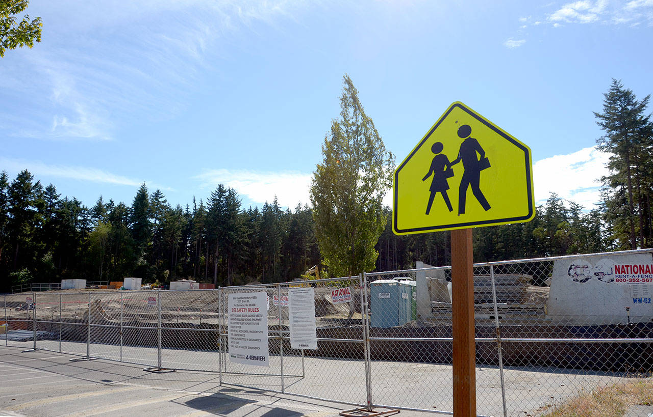 Caption: On Friday, a hearing examiner will continue a public hearing on a proposed parking lot on Grant Street for the Port Townsend School District’s new Salish Coast Elementary School, which is currently under construction. (Cydney McFarland/Peninsula Daily News)