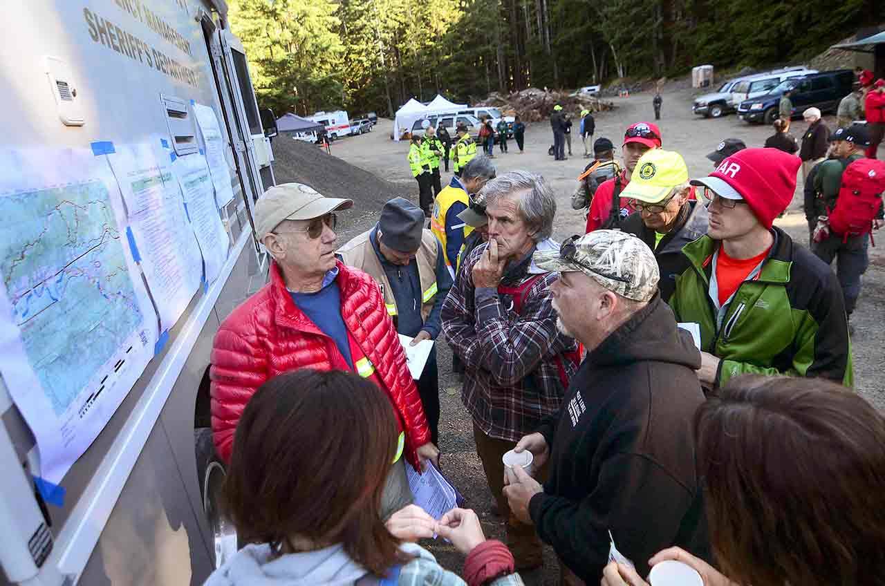 The family of Jacob Gray, who has been missing since early April, is briefed Saturday before searching the Sol Duc River for Gray. (Jesse Major/Peninsula Daily News)