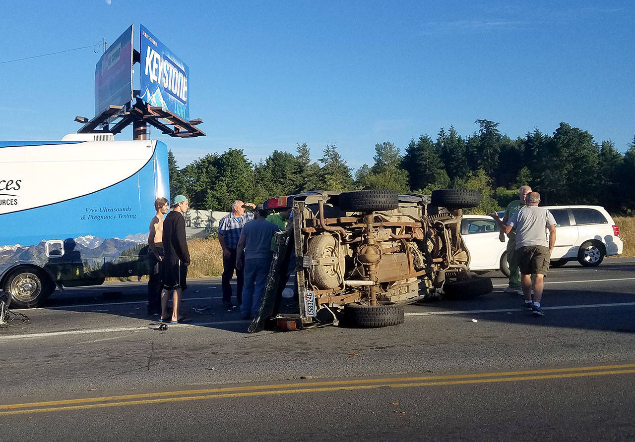 A 1997 Ford Ranger flipped at about 7:40 p.m. Tuesday at U.S. Highway 101 and Kolonels Way east of Port Angeles. (Jesse Major/Peninsula Daily News)