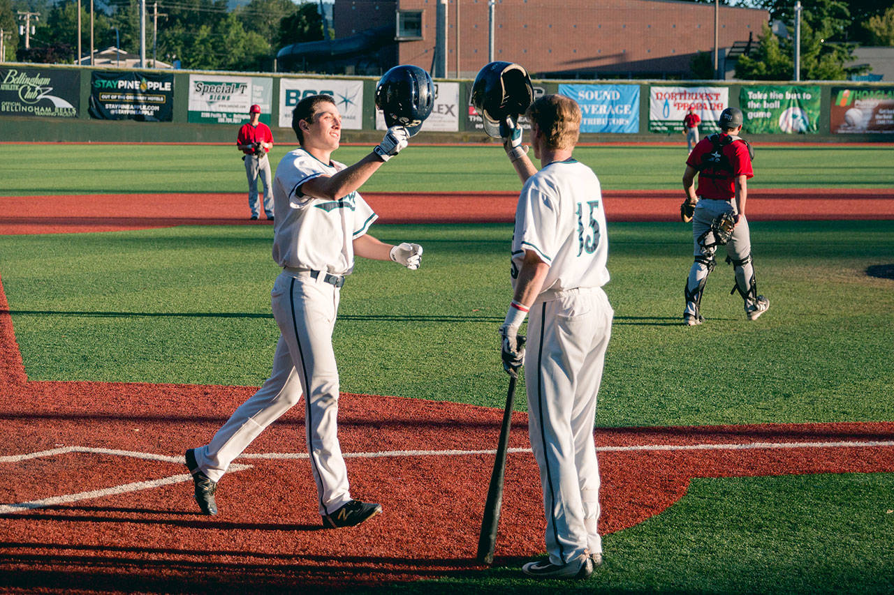 Alex Powell                                 Sequim’s Evan Hurn, left, celebrates his first West Coast League home run with Bellingham Bells teammate Ernie Yake. Hurn, a 2016 Sequim graduate and former Wilder Baseball player, returns to Civic Field this weekend to play the Port Angeles Lefties.