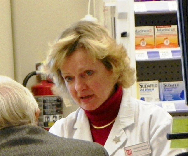 Pharmacist Vivian Brown assists a customer at Walgreens.
