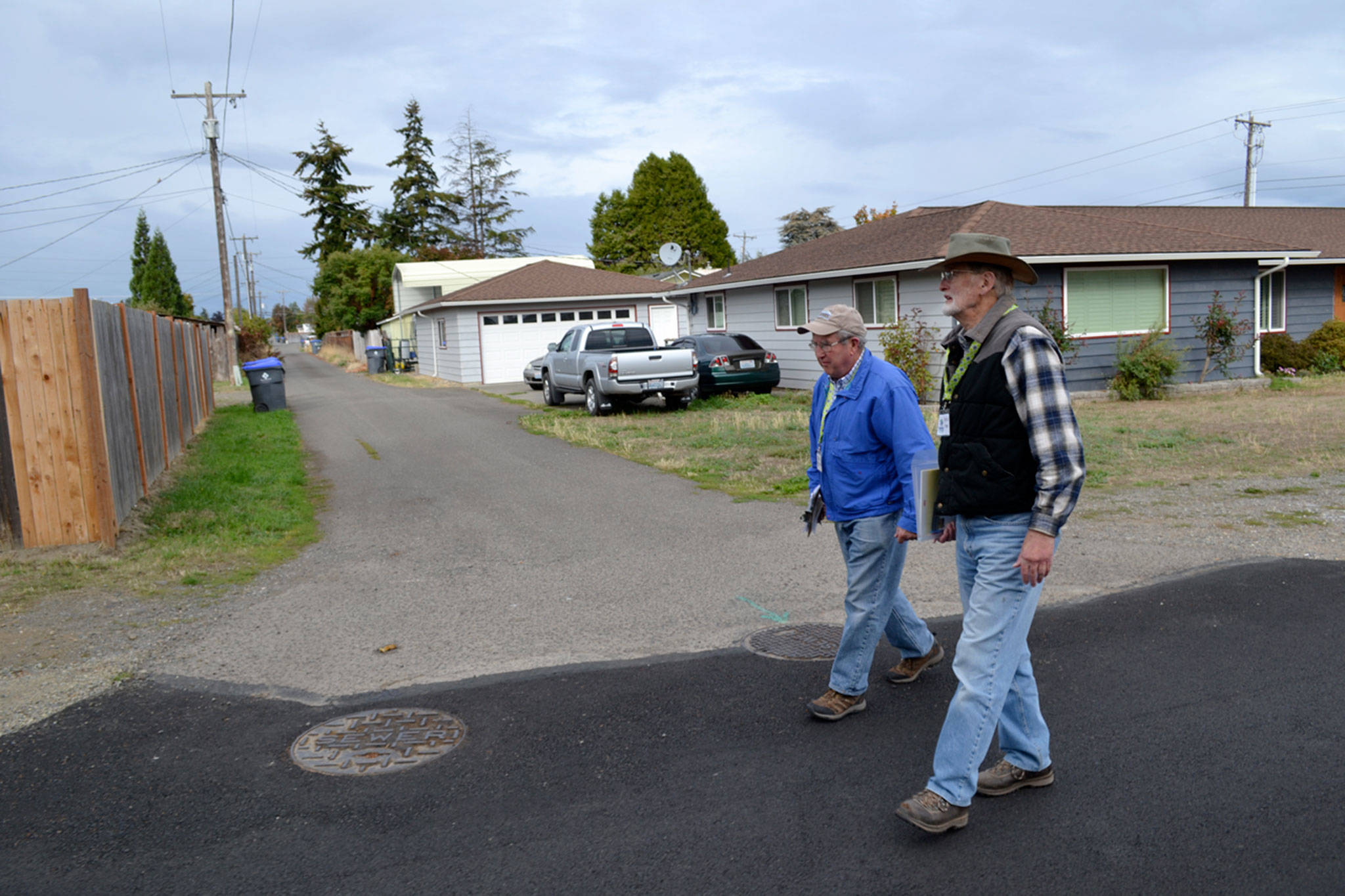 Matthew Nash/Olympic Peninsula News Group                                In September 2015, Ernie Karger, a Habitat for Humanity volunteer, and Bryce Fish with Sequim Sunrise Rotary assess homes near Fir Street as part of the Habitat for Humanity of Clallam County’s Neighborhood Revitalization project.