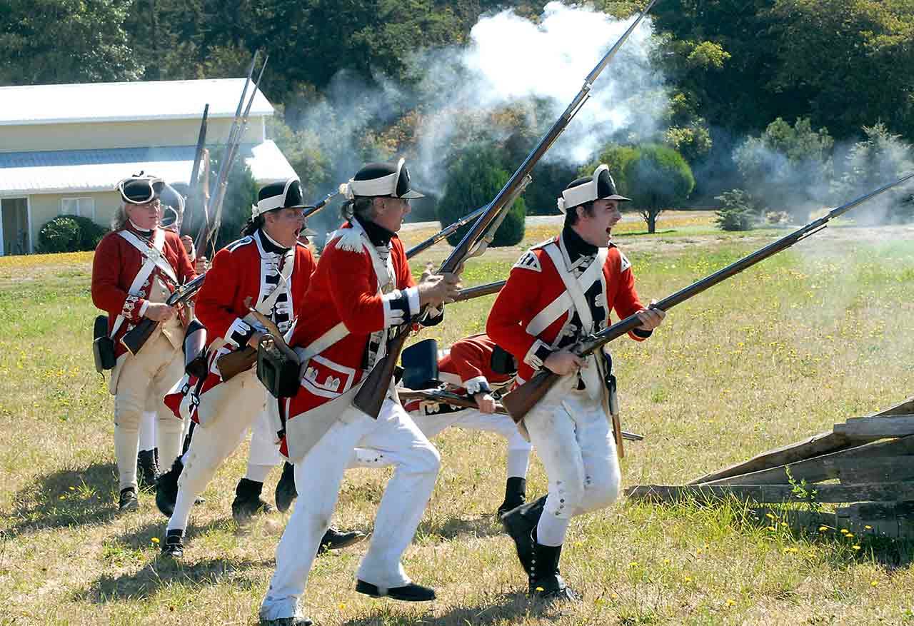 Revolutionary War re-enactors stage a version of the 1775 Battle of Lexington Green last year as part of the Northwest Colonial Festival at the George Washington Inn and Lavender Farm near Agnew. (Keith Thorpe/Peninsula Daily News)