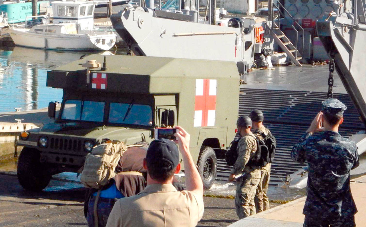 A M997A2 Humvee offloads from a landing craft during the U.S. Navy’s 3rd Fleet amphibious exercise in Westport. (Jim Buck)