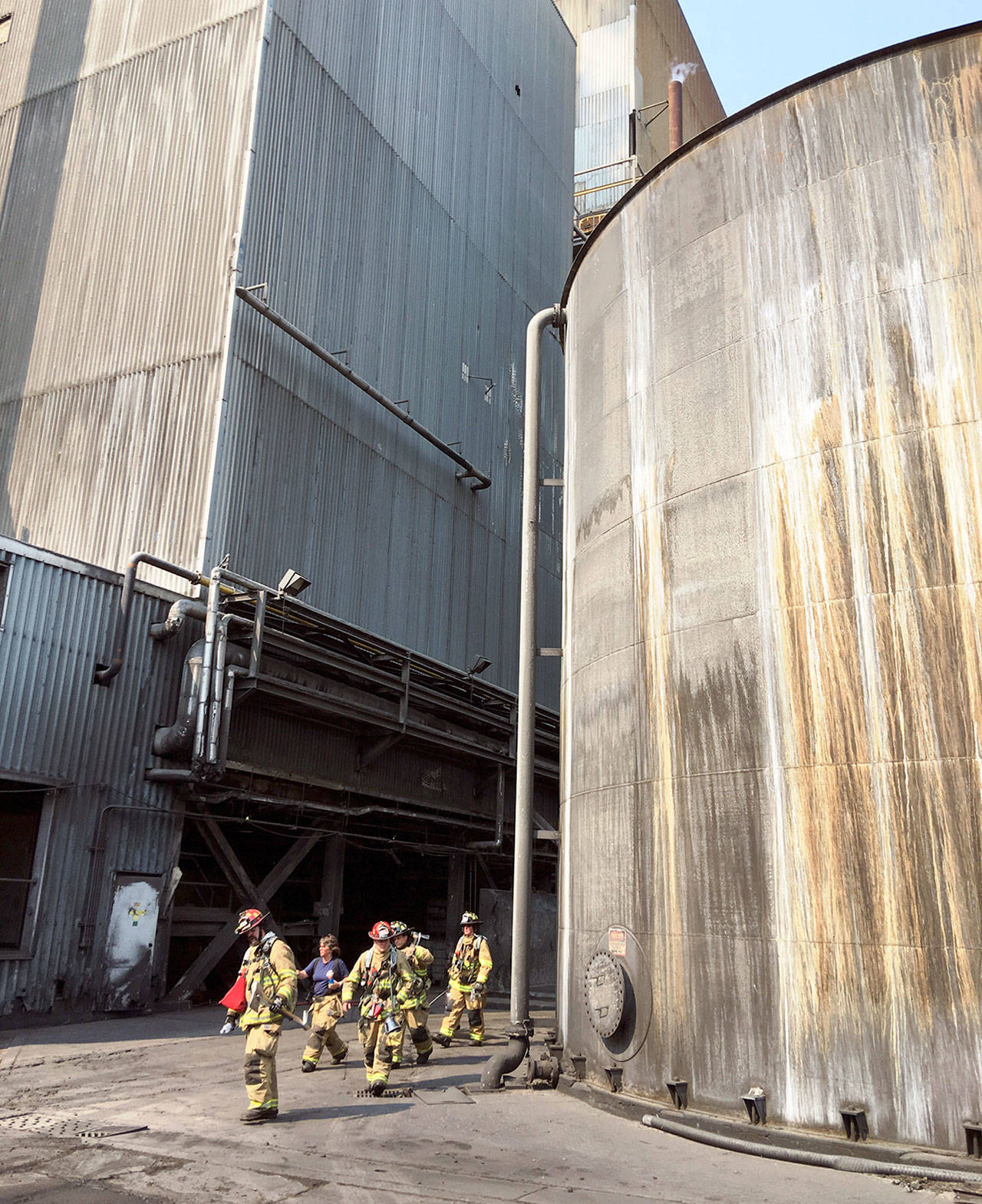 East Jefferson Fire-Rescue firefighters gather at the Port Townsend Paper Corp. mill, where a blaze was quickly extinguished. (East Jefferson Fire-Rescue)