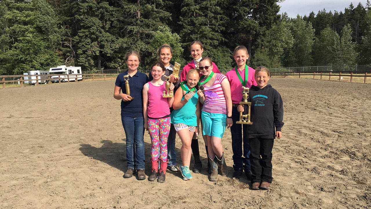 The high-point winners from the Clallam County 4-H pre-fair horse show in July were, in the back row, from left, Sierra Steffen, Emily Gear, Katie Marshant and Taylor Maugham; and in the front row from left, Madison Heistand, Heidi Leitz, Ruby Coulson and Paige Reed. (Katie Salmon-Newton)