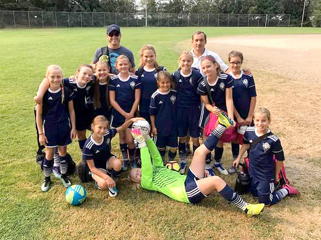 The Stormking girls U12 team from the Olympic Peninsula played in the Blast Off Tournament last weekend in Federal Way, going 3-0-1 to win the tournament. From left, front, are Taryn Johnson, Paige Mason and Kinzley Henrikson. From left, rear, are Isabelle Felton, Becca Van Dyken, Cami Bohman, Eve Breithaupt, Chloe Ferro-May, Raimey Brewer, Jolene Vaara, Waverly Mead and Julia Raupp. The coaches are Dustin Curb and Jay Marazon.