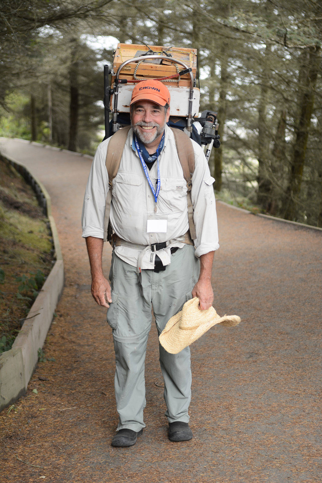 Robin Weiss of Poulsbo hikes into his Paint the Peninsula locations, gear and snacks on his back. During this year’s event Aug. 21-27, he hopes to paint at Cape Flattery. (Port Angeles Fine Arts Center)