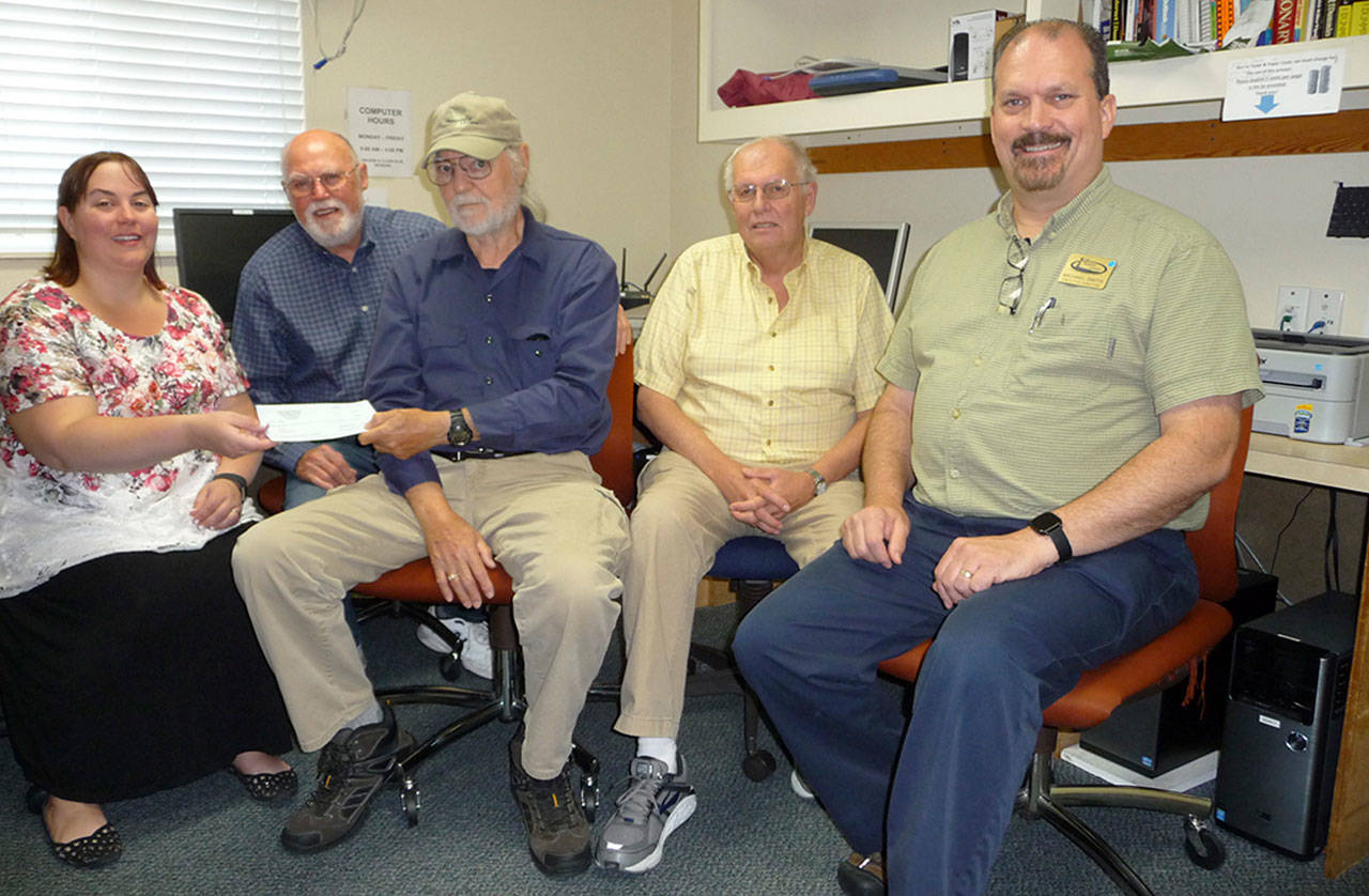 From left are Michelle Rhodes of Shipley Center, Tom LaMure and Jim Hurley of the Sequim PC Users Group, Steve Solberg of SPCUG and Shipley Center’s IT specialist, and Shipley Center Executive Director Michael Smith. (Patricia Morrison Coate/Olympic Peninsula News Group)