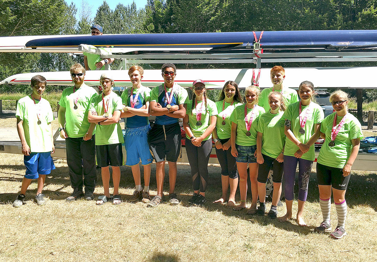 The Olympic Peninsula Junior Rowers at the Row for a Cure Regatta late last month in Vancouver. From left are Vince Pavlak, Jake McGovern, Jack Feingold, Zach Gavin, Daniel Weaver, Nathan Mishler, Maggie Van Dyken, Lisa Martin, Lica Kennedy, Cyras Mills, Shannon Callahan, Ella Ventura and Veronica Kennedy.