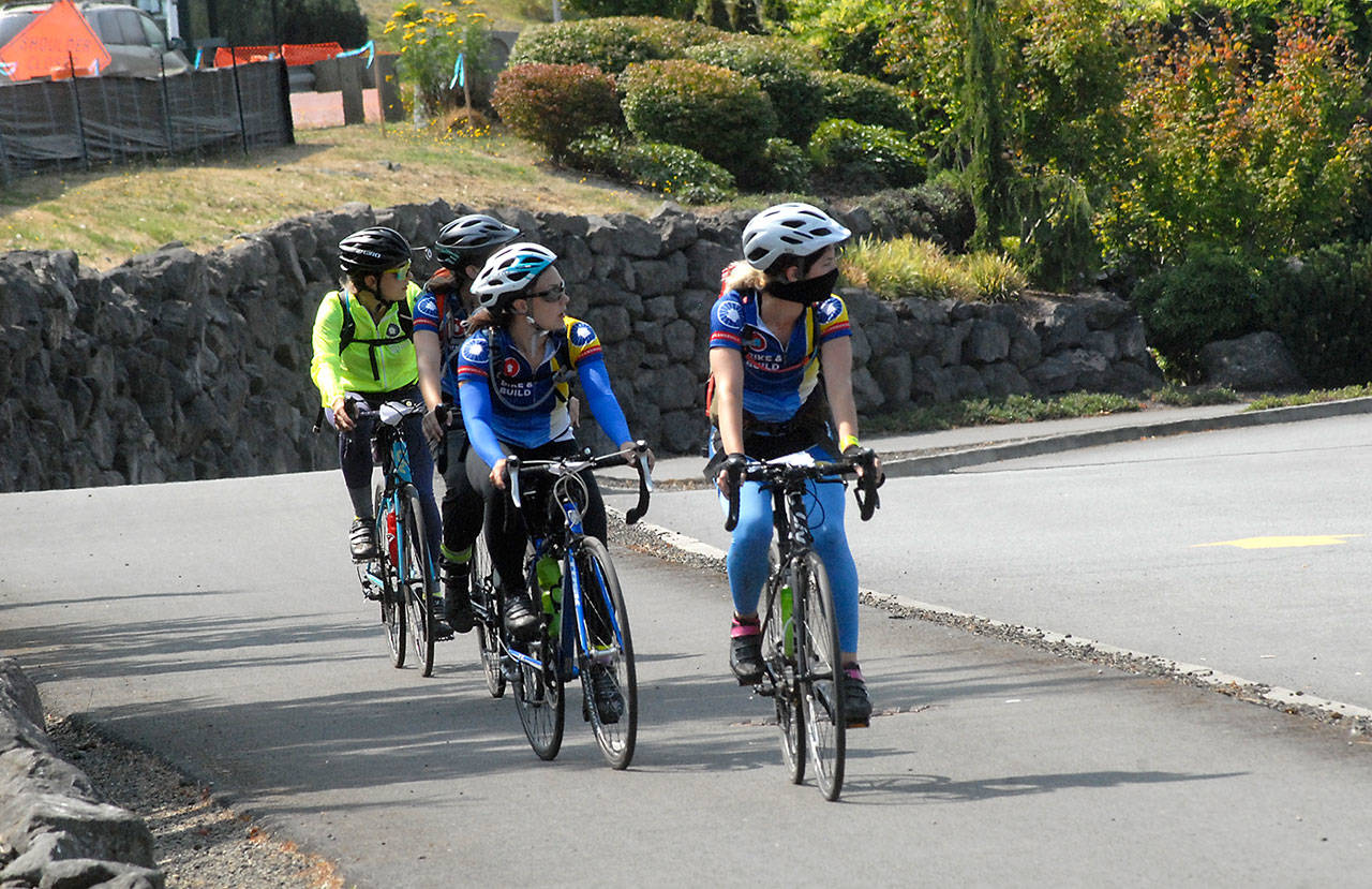 A group of bicyclists enjoy the view as they pedal on the Olympic Discovery Trail through the Jamestown S’Klallam tribal government campus in Blyn on Saturday. (Keith Thorpe/Peninsula Daily News)