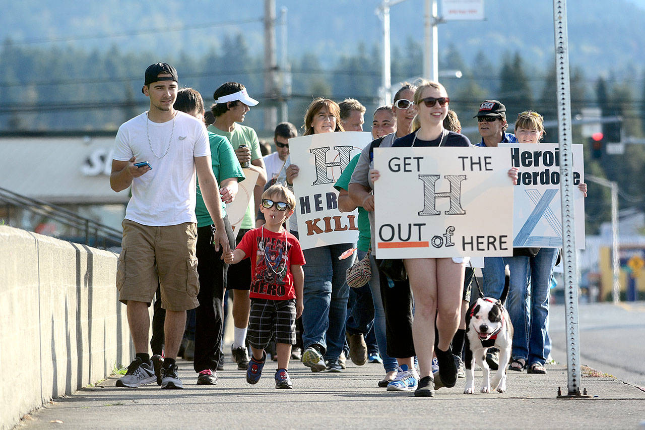 Hundreds walk down Lincoln Street during an overdose awareness walk in 2016. (Jesse Major/Peninsula Daily News)