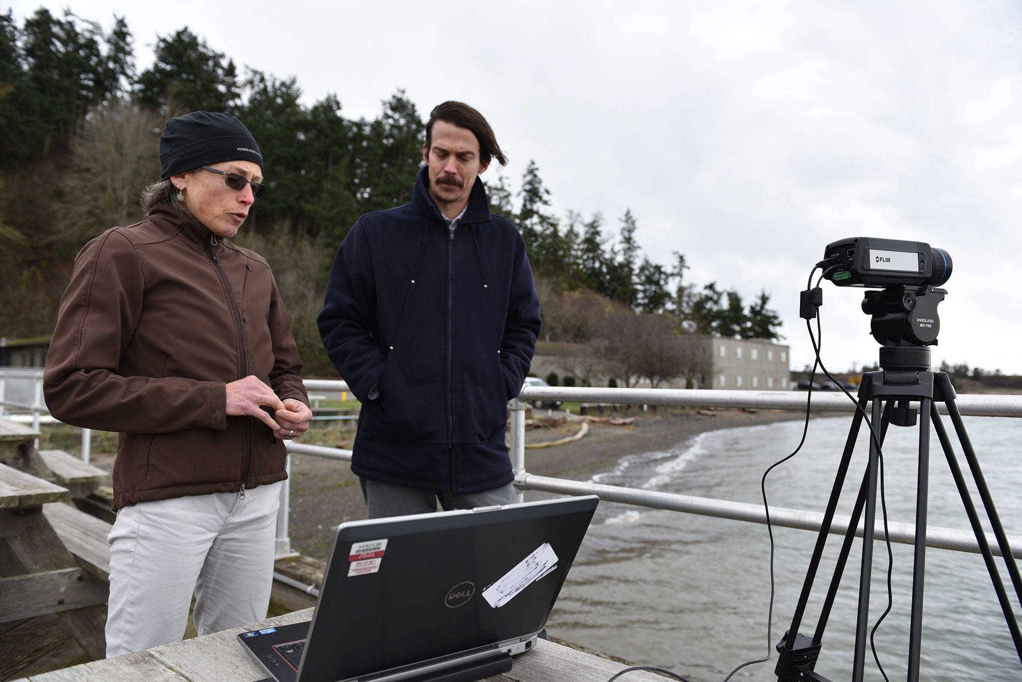 Engineers Shari Matzner and Garrett Staines with Pacific Northwest National Laboratory’s Marine Sciences Laboratory discuss their development of software that will analyze thermal video to help birds and bats co-exist with offshore wind farms. (Eric Francavilla/Pacific Northwest National Laboratory)