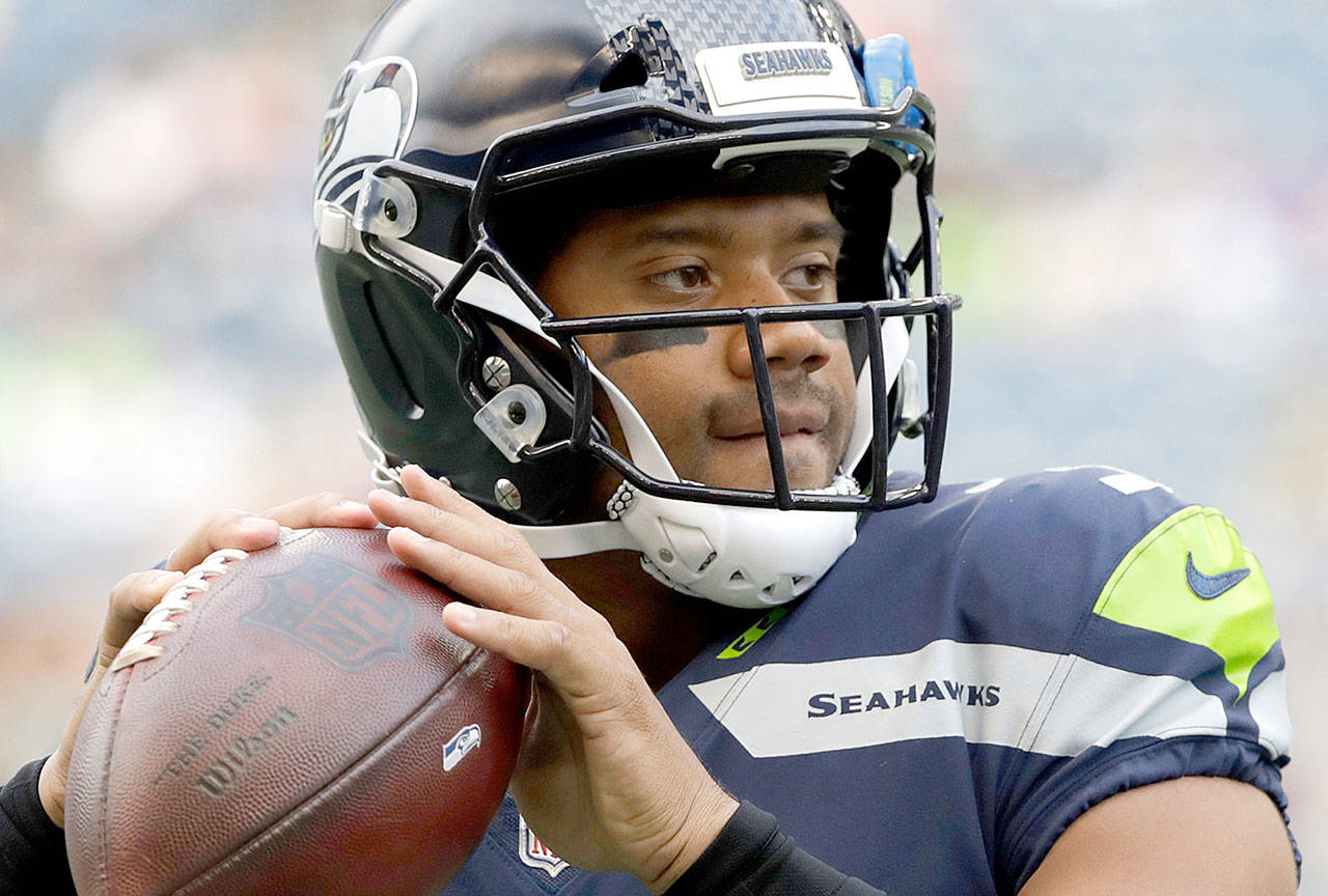 Seattle Seahawks quarterback Russell Wilson warms up before an NFL preseason football game against the Minnesota Vikings in Seattle. The Seahawks head into the 2017 season as clear favorites in their division and again likely contenders for an NFC championship. (The Associated Press)