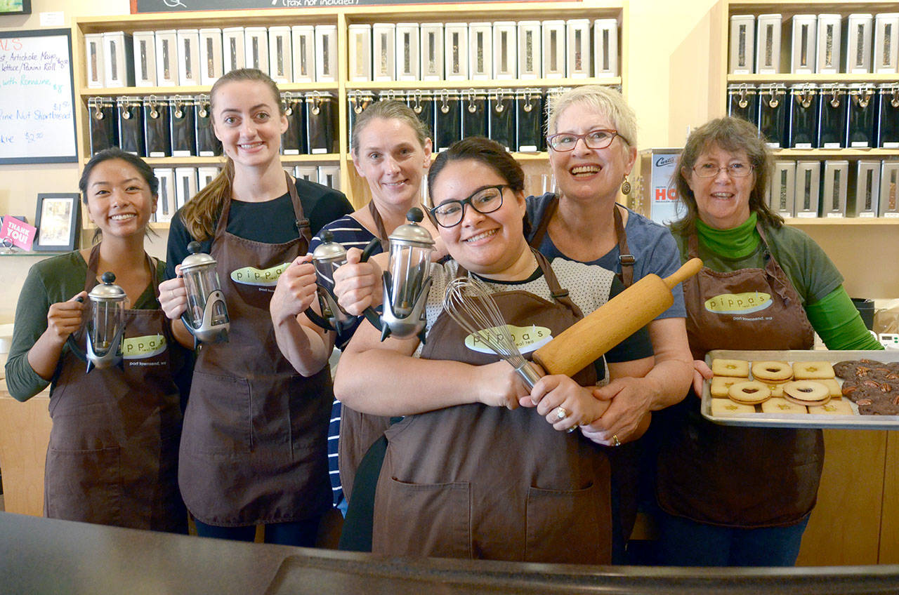Pippa’s Real Tea staff Mara Pham, Mollie West, manager Julie Marquez, owner Pippa Mills, Kirsten Boyd and Jacque Peters, from left, pose in the small tea shop in Port Townsend that was just voted best tea shop in the Seattle area for the second year in a row. (Cydney McFarland/Peninsula Daily News)