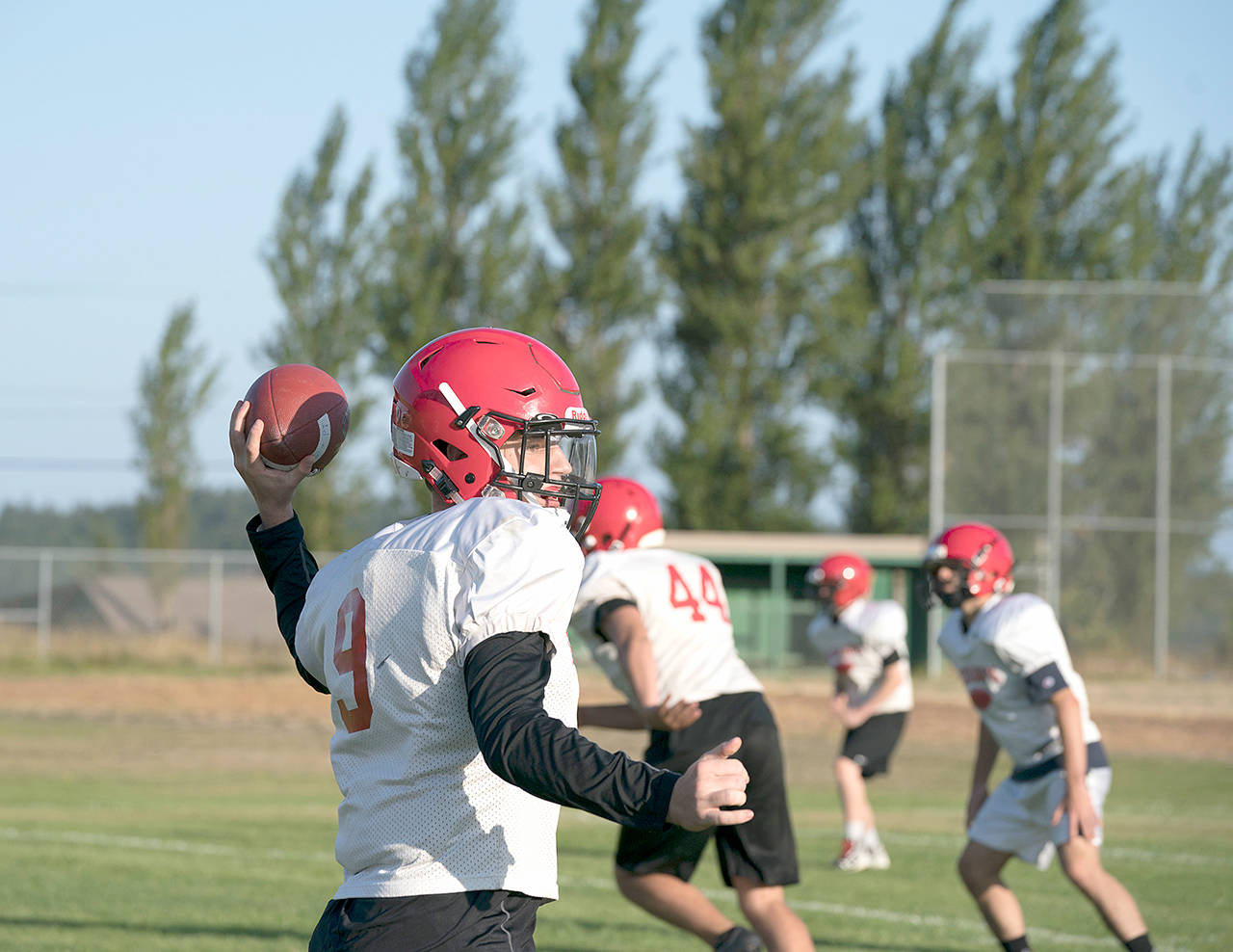 Steve Mullensky/for Peninsula Daily News Noa Apker-Montoya throws during a preseason practice last month. The Redhawks face Port Angeles tonight in their season opener.
