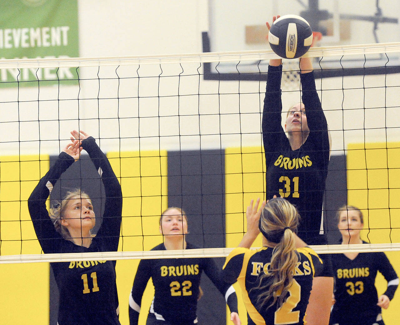 Miriam Wonderly (31) for Clallam Bay goes for the block against Forks’ Julia Lausche Monday in Clallam Bay where Forks defeated the Bruins 3-1. Also in on the action for Clallam Bay are from left Kaitlyn Tyree (11), Hannah Olson (22), and Kaitlyn Willis (33). (Lonnie Archibald/for Peninsula Daily News)                                Clallam Bay’s Miriam Wonderly (31) goes for the block against Forks’ Julia Lauscheduring the Spartans 3-1 win over the Bruins. Also in on the action for Clallam Bay are from left Kaitlyn Tyree (11), Hannah Olson (22), and Kaitlyn Willis (33).                                Lonnie Archibald/for Peninsula Daily News