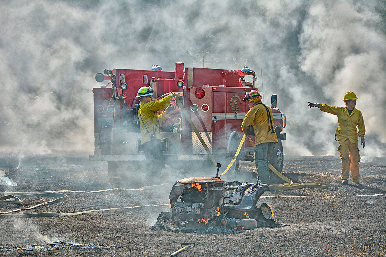 Clallam County Fire District No. 2 responds to a grass fire on Lower Elwha Road on Friday afternoon. (Jay Cline/Clallam County Fire District No. 2)