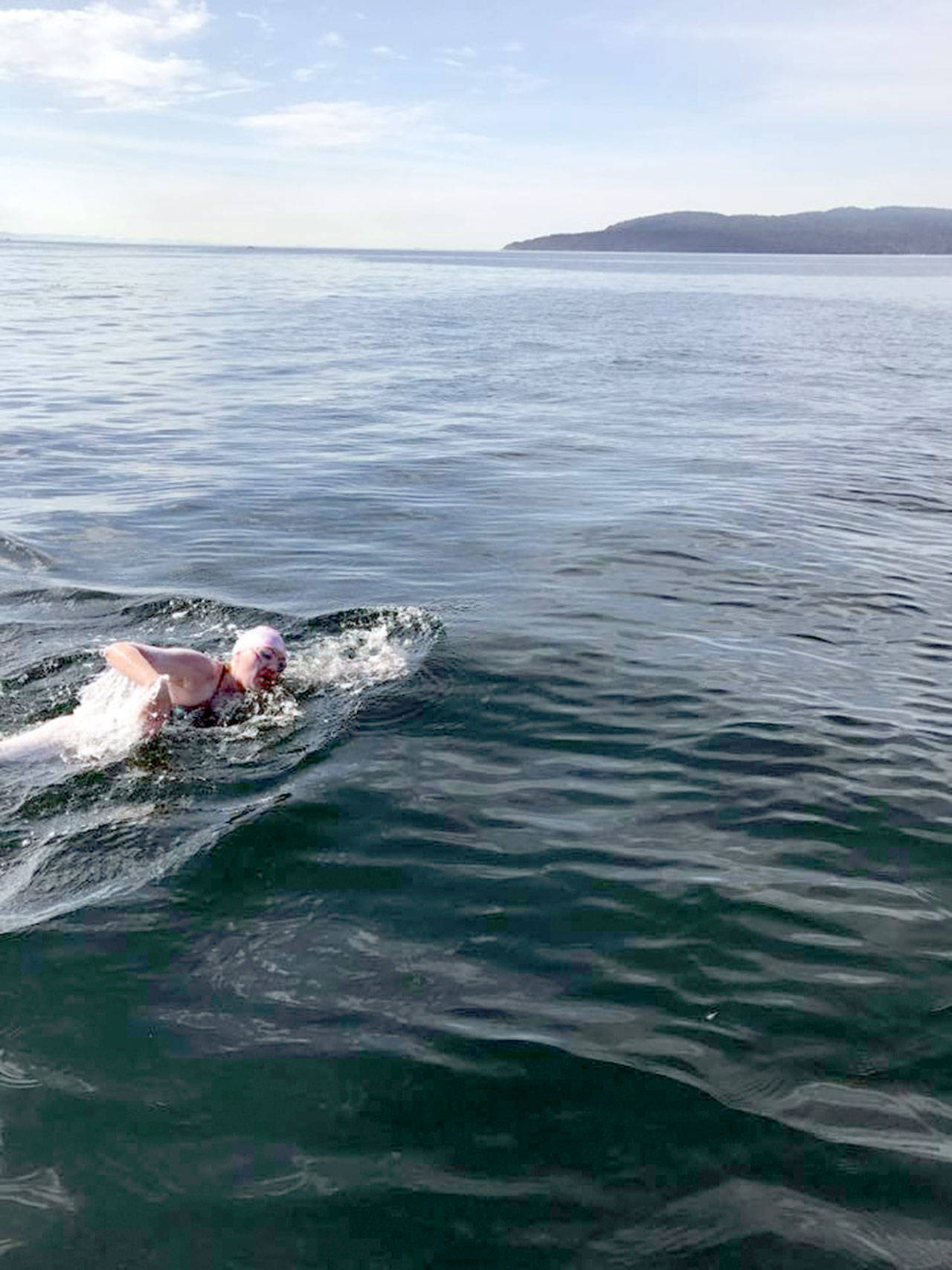 Swimmer Melissa Blaustein makes her way to the Race Rocks area west of Victoria, B.C. around 3:30 p.m. Saturday. Blaustein completed her trek across the Strait of Juan de Fuca at 3:43 p.m. (Northwest Open Water Swimming Association)
