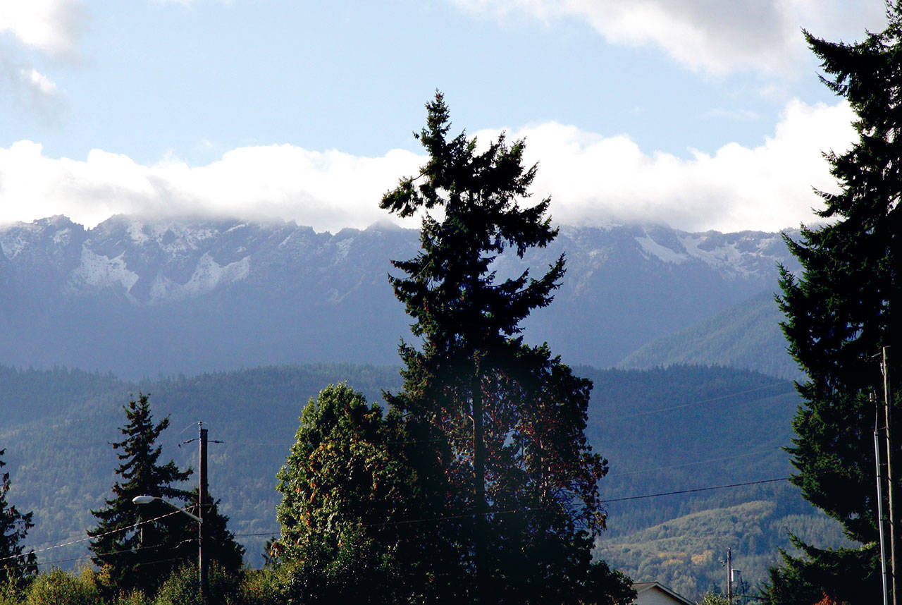 Fresh snow dusts the Olympic Mountains overlooking Port Angeles on Monday morning. (Dave Logan/for Peninsula Daily News)