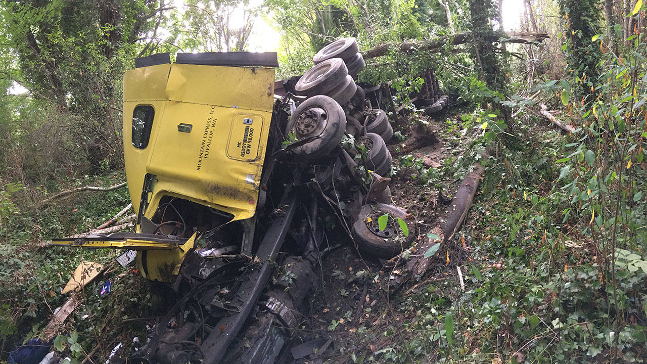 A semitruck veered off state Highway 104 on Tuesday afternoon. The wreck sent two people to the hospital. (Bill Beezley/East Jefferson Fire-Rescue)