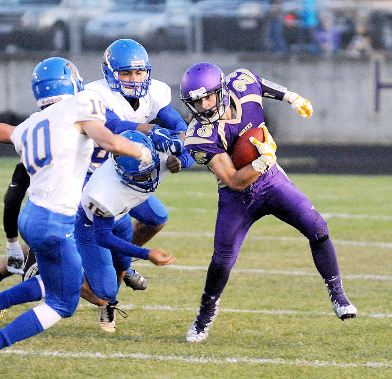Sequim&rsquo;s Gavin Velarde (23) slips a tackle en route to a first down Friday night. The visiting Knights reeled off 20 second-half points to knock off Sequim 30-22.Velarde had two touchdowns in the loss. (Michael Dashiell/Olympic Peninsula News Group)