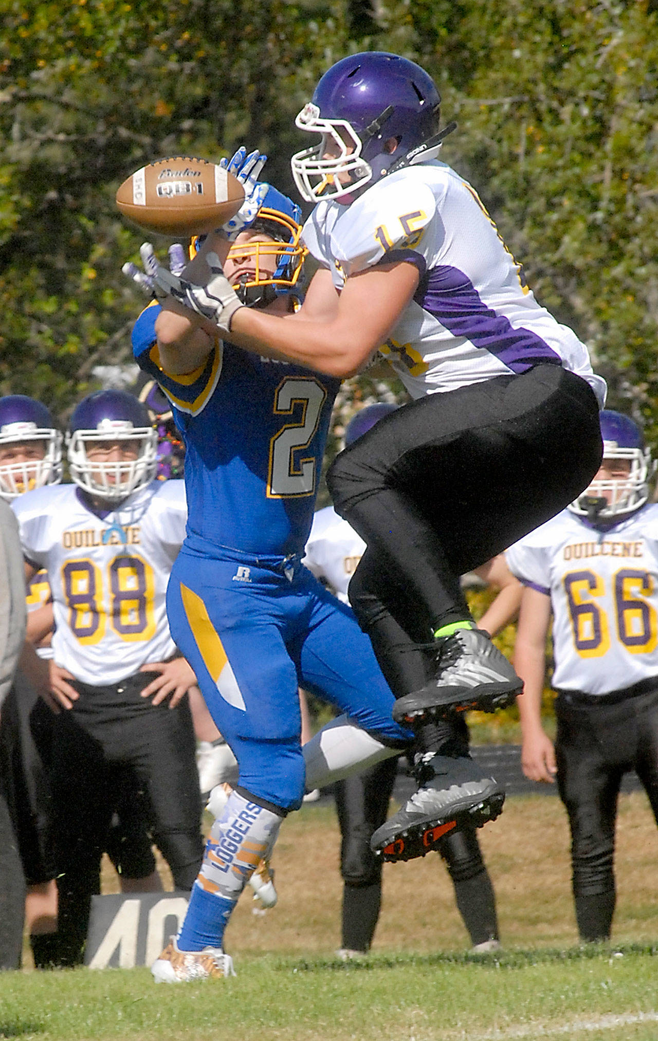 Keith Thorpe/Peninsula Daily News Crescent’s Robert Cox, left, breaks up the pass to Quilcene’s Eli Mahan in the first quarter of Saturday’s game in Joyce.                                 Crescent’s Robert Cox, left, breaks up the pass to Quilcene’s Eli Mahan in the firstquarter of Saturday’s game in Joyce. (Keith Thorpe/Peninsula Daily News)