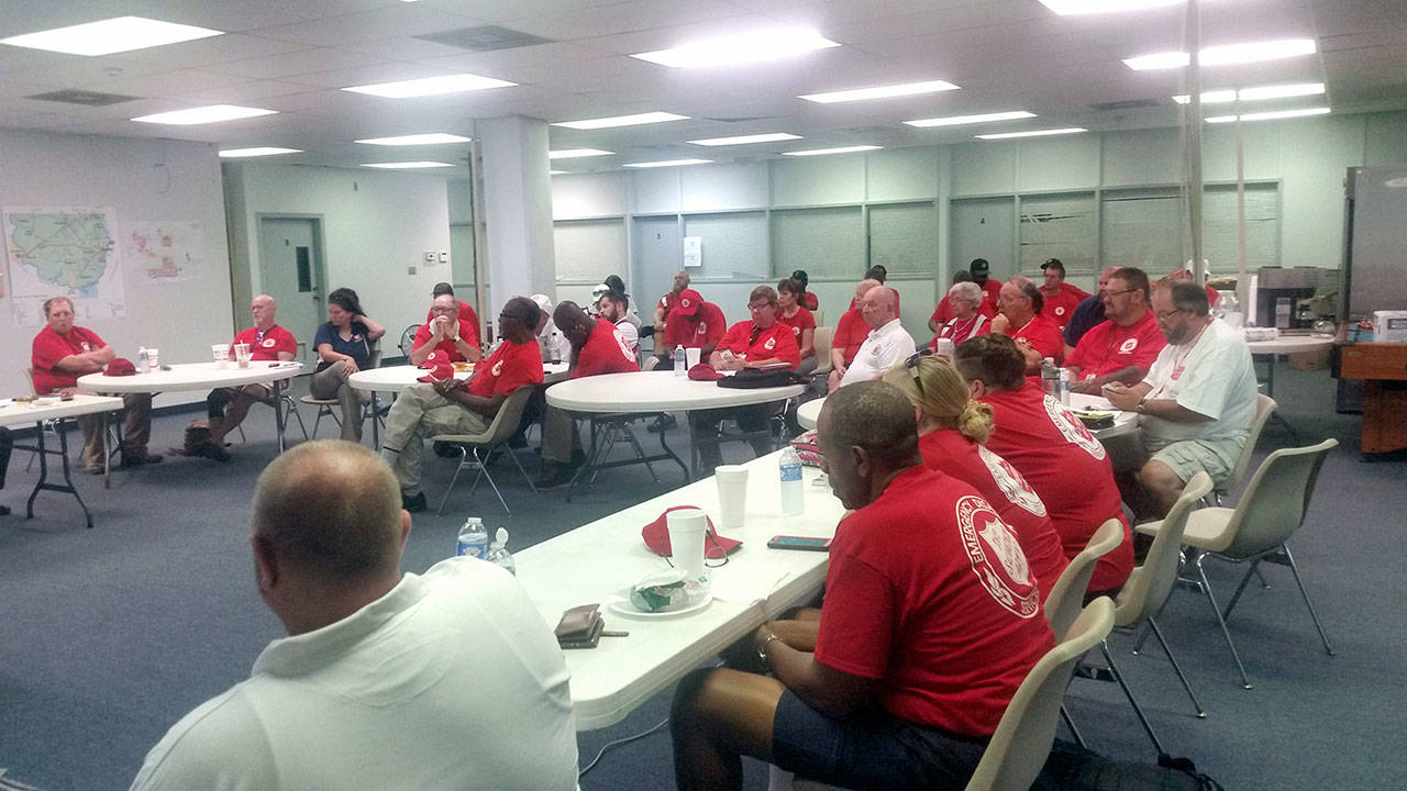 Salvation Army volunteers gather for a meeting in a distribution warehouse in Beaumount, Texas. Ron Wehnau of Port Angeles will serve as safety officer of that facility until Friday, Oct. 6. (Ron Wehnau)