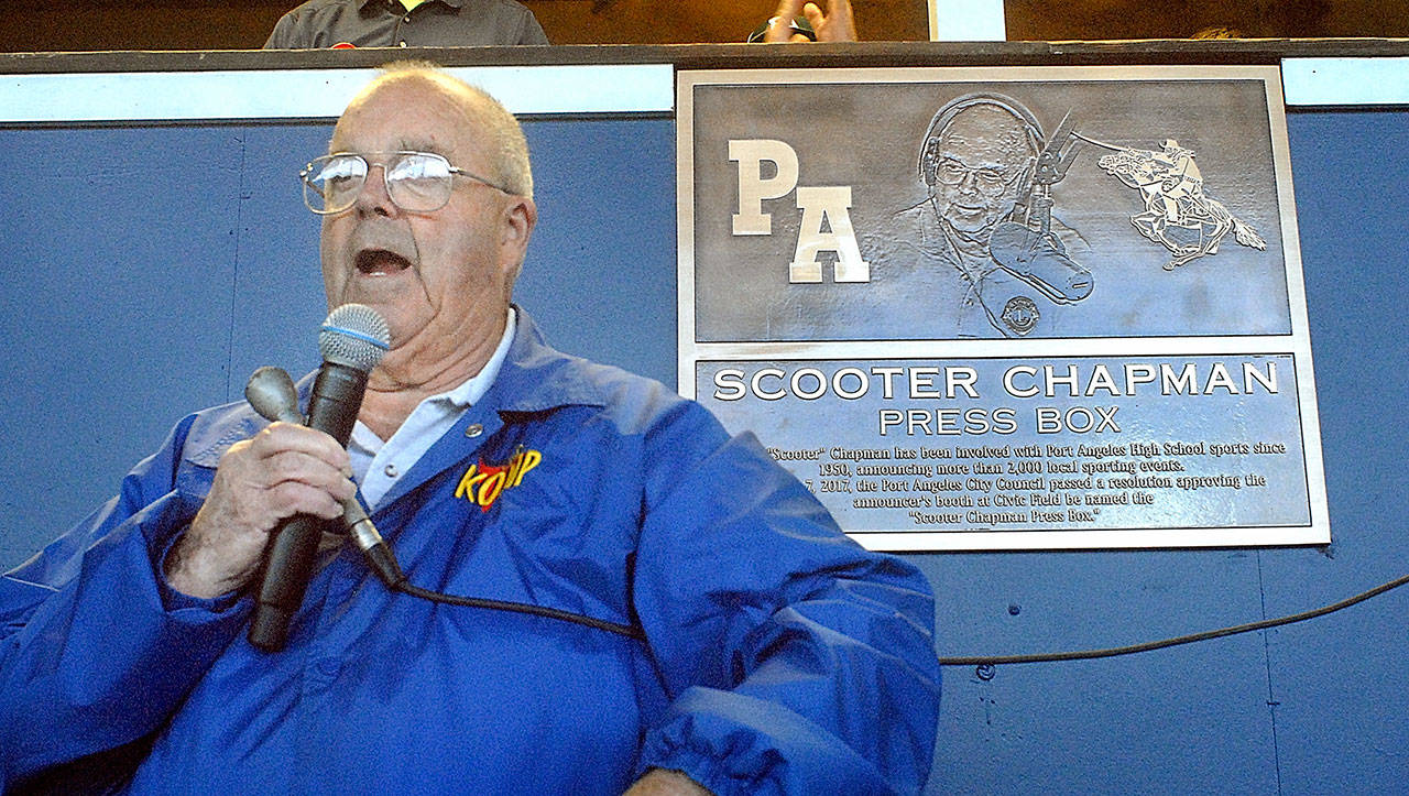 KONP Radio sportscaster Howard “Scooter” Chapman speaks to the crowd after the unveiling of a plaque naming the press booth at Port Angeles Civic field the Scooter Chapman Press Box. Chapman was honored at the beginning of Friday evening’s Port Angeles High School football game for his involvement with high school sports since the 1950s.                                Keith Thorpe/Peninsula Daily News