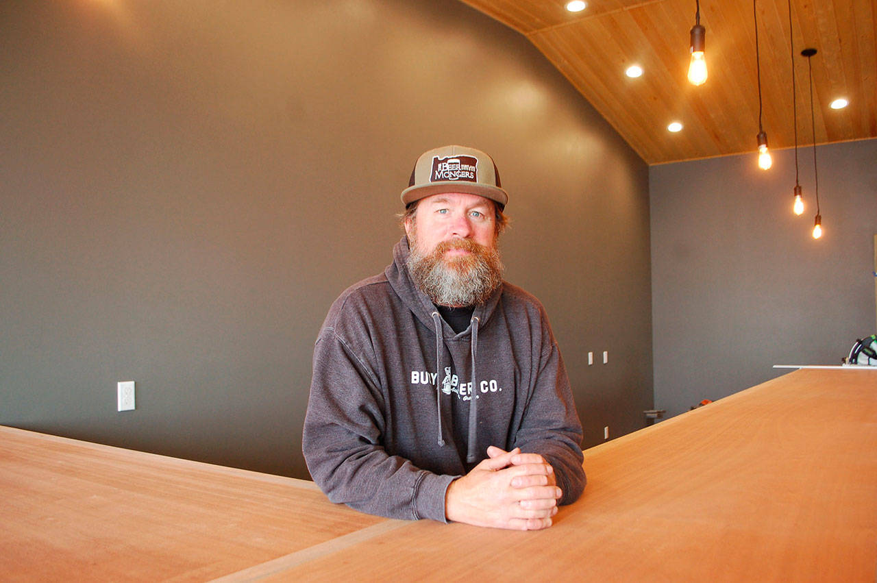 Agnew resident Sean O’Neill talks about the opening of his new business, Peninsula Taproom, at the intersection of West Washington Street and North Second Avenue that will open the first week of October. (Erin Hawkins/Olympic Peninsula News Group)