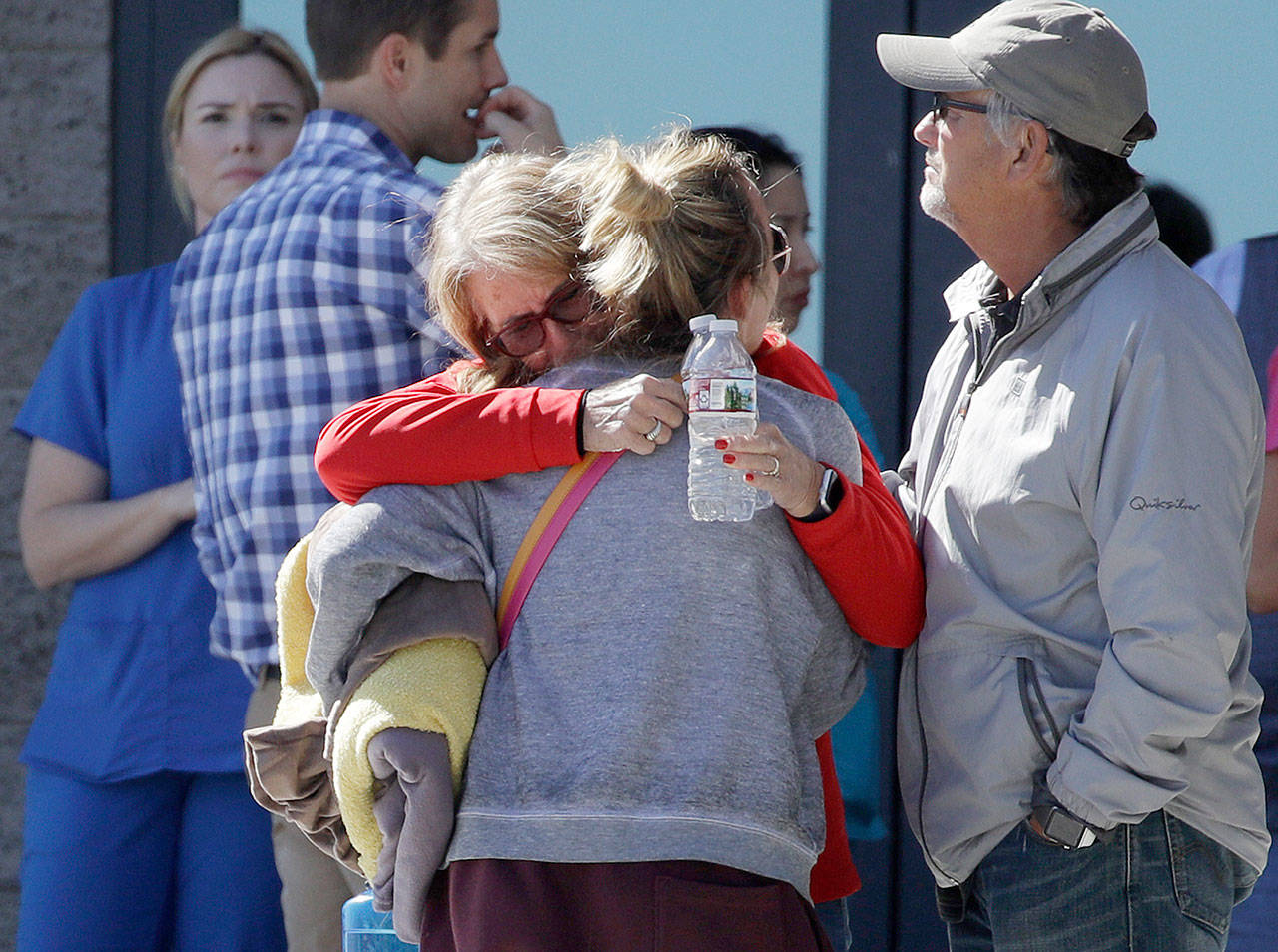 Two women embrace outside of a family assistance center Monday in Las Vegas. The makeshift center was set up to help families and others reconnect after the mass shooting on the Las Vegas Strip. (John Locher/The Associated Press)