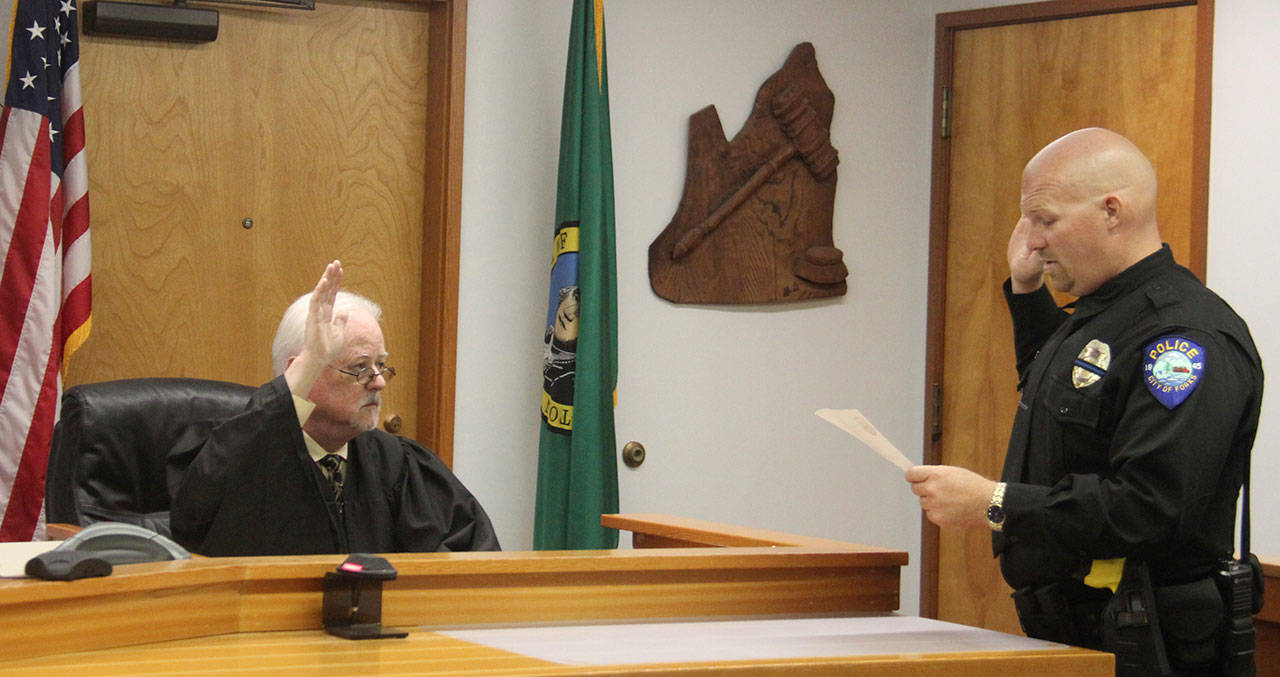 Judge John Doherty swears in Mike Rowley as Forks’ next police chief. (Christi Baron/Olympic Peninsula News Group)