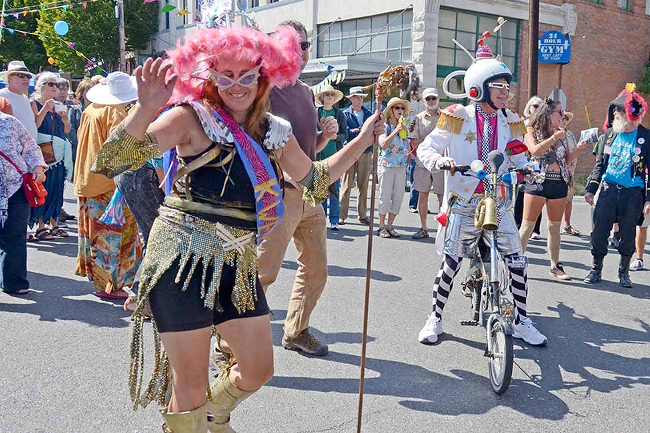 Kween Caption: Reigning Kinetic Kween and first year sculpture racer Lisa Doray of Port Townsend dances in the Uptown Street Fair with her team IPA. (Cydney McFarland/Peninsula Daily News)