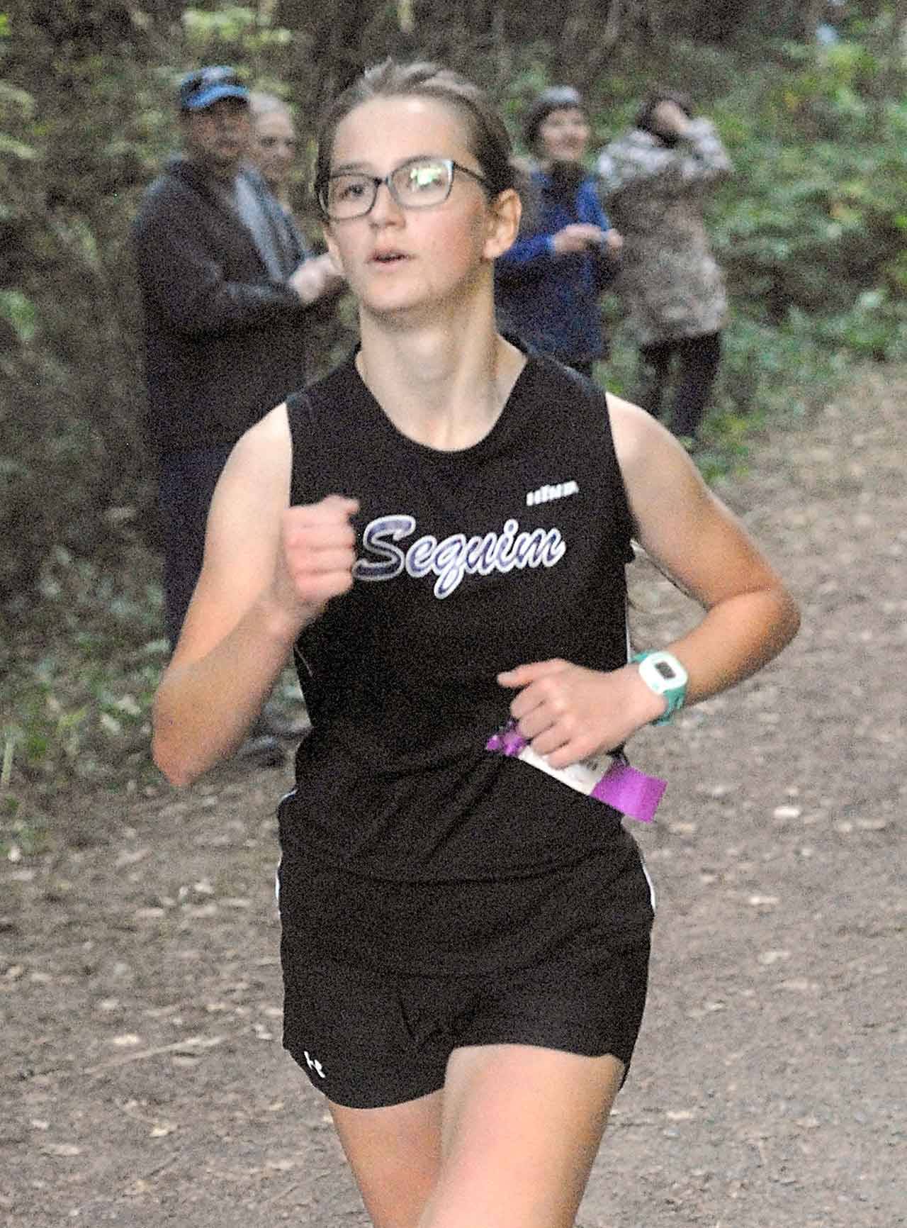 Kaitlyn Viada of Sequim races to a third-place finish in Wednesday’s cross-country meet.                                Keith Thorpe/Peninsula Daily News