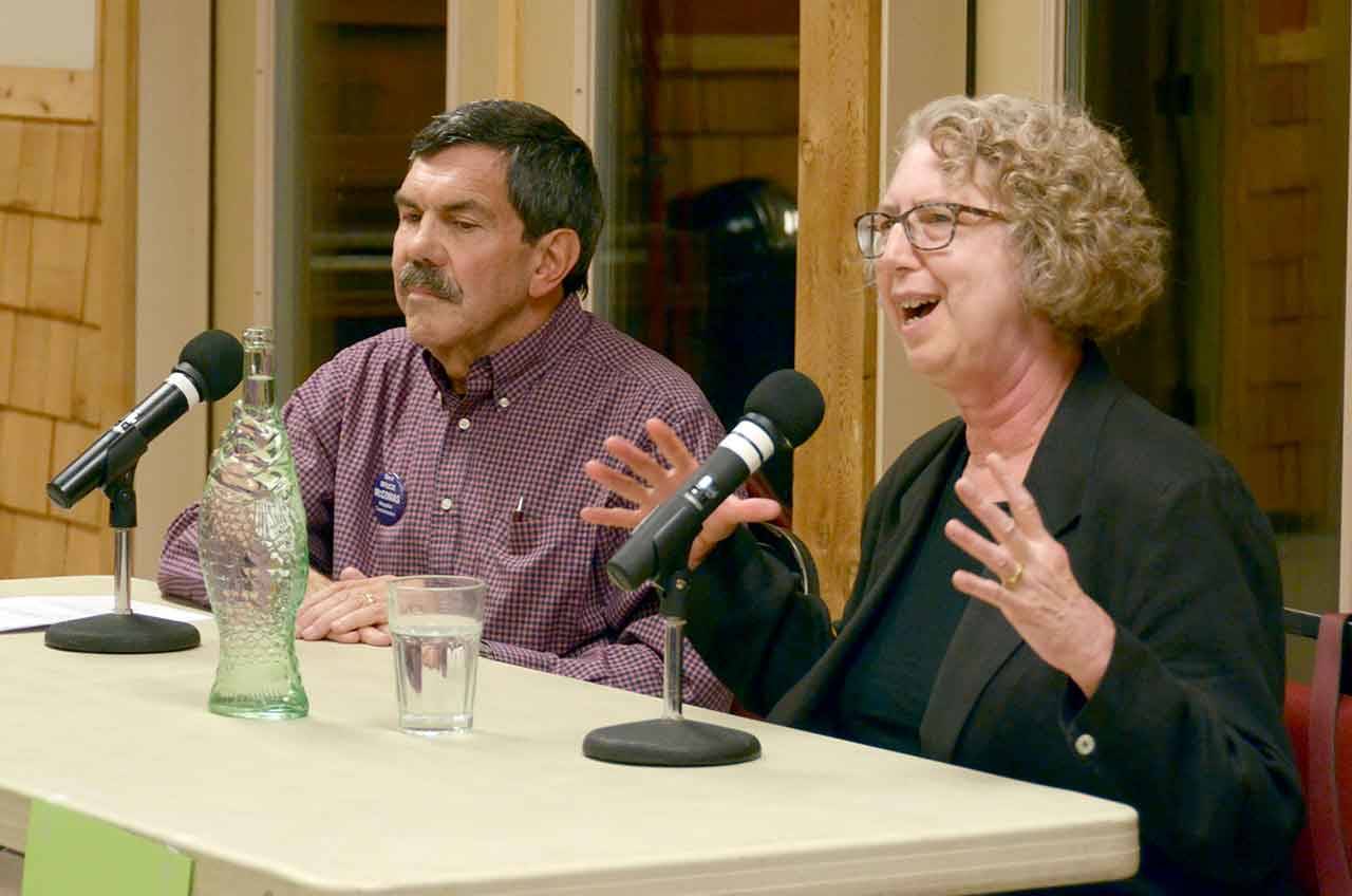 Bruce McComas and Cheri Van Hoover, both running for the Jefferson Healthcare hospital commission, spoke at a candidate forum in Quilcene and answered questions from the community. (Cydney McFarland/Peninsula Daily News)