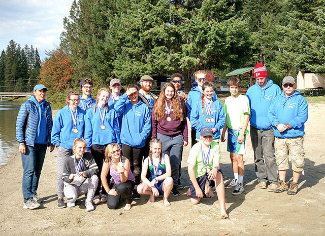 The Olympic Peninsula Rowing Association in Priest River, Idaho. From left, front, are Angelica Kennedy, Veronica Kennedy, Shannon Callahan and Jack Feingold. From left, middle row, are Coach Debby Swinford, Maggie VanDyken, Emily Sirguy, Lisa Martin, Maria England, Ella Ventura, Vince Pavlak and Patrick Callahan. From left, rear, are Harrison Fulton, Tyler Turner, Jake McGovern, Nathan Mishler, Daniel Weaver and Coach Calum Swinford.