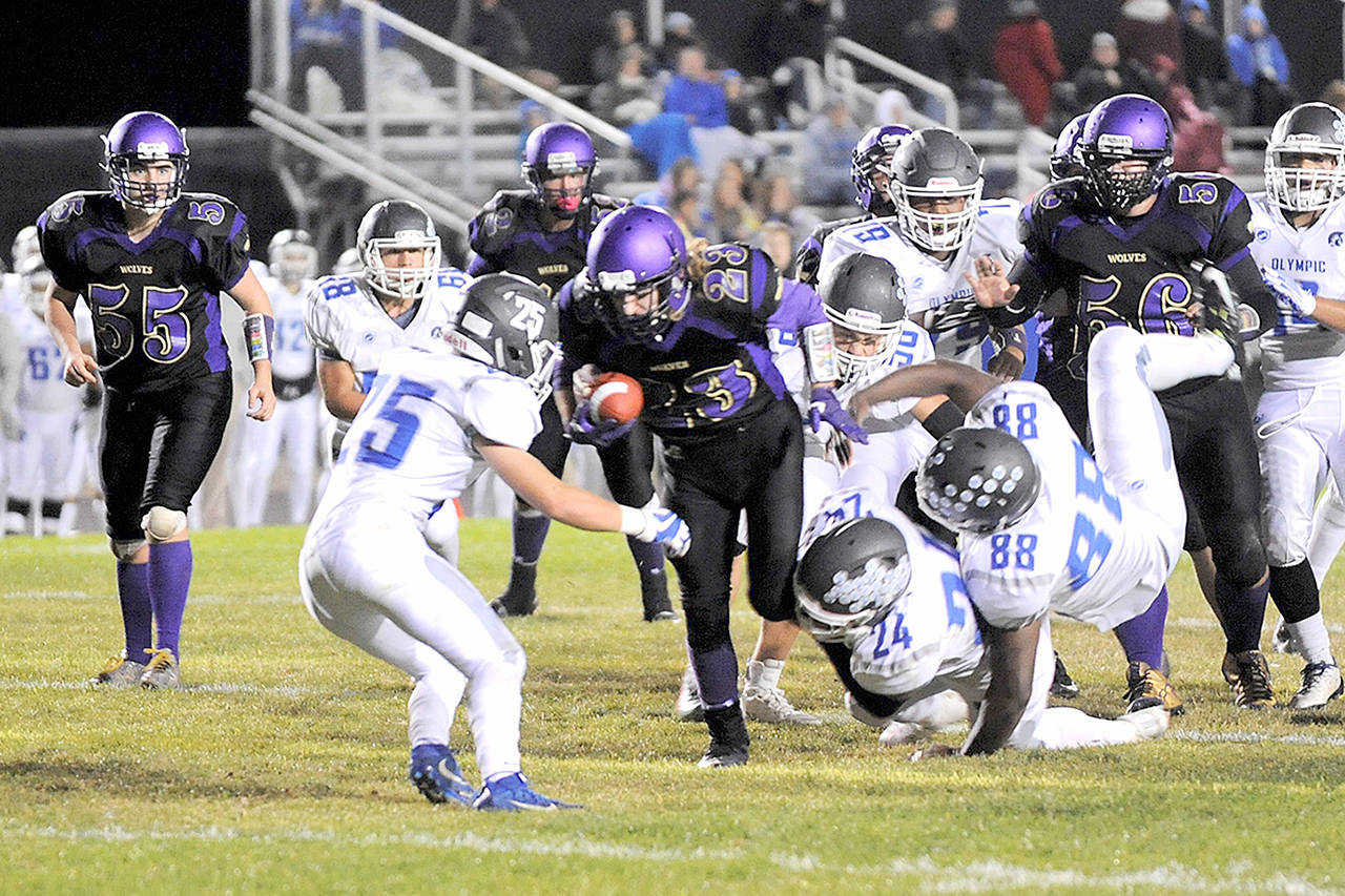 Sequim’s Gavin Velarde scored two second half touchdowns as the Wolves pushed past Olympic in the second half for a 31-18 win.                                Matthew Nash/Olympic Peninsula News Group