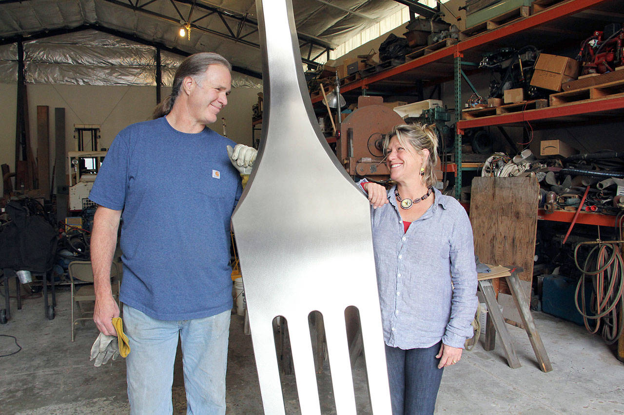 Lucy Congdon Hanson and Walt Trisdale pose with their cutlery creation “Serve.” (Bonnie Obremski)