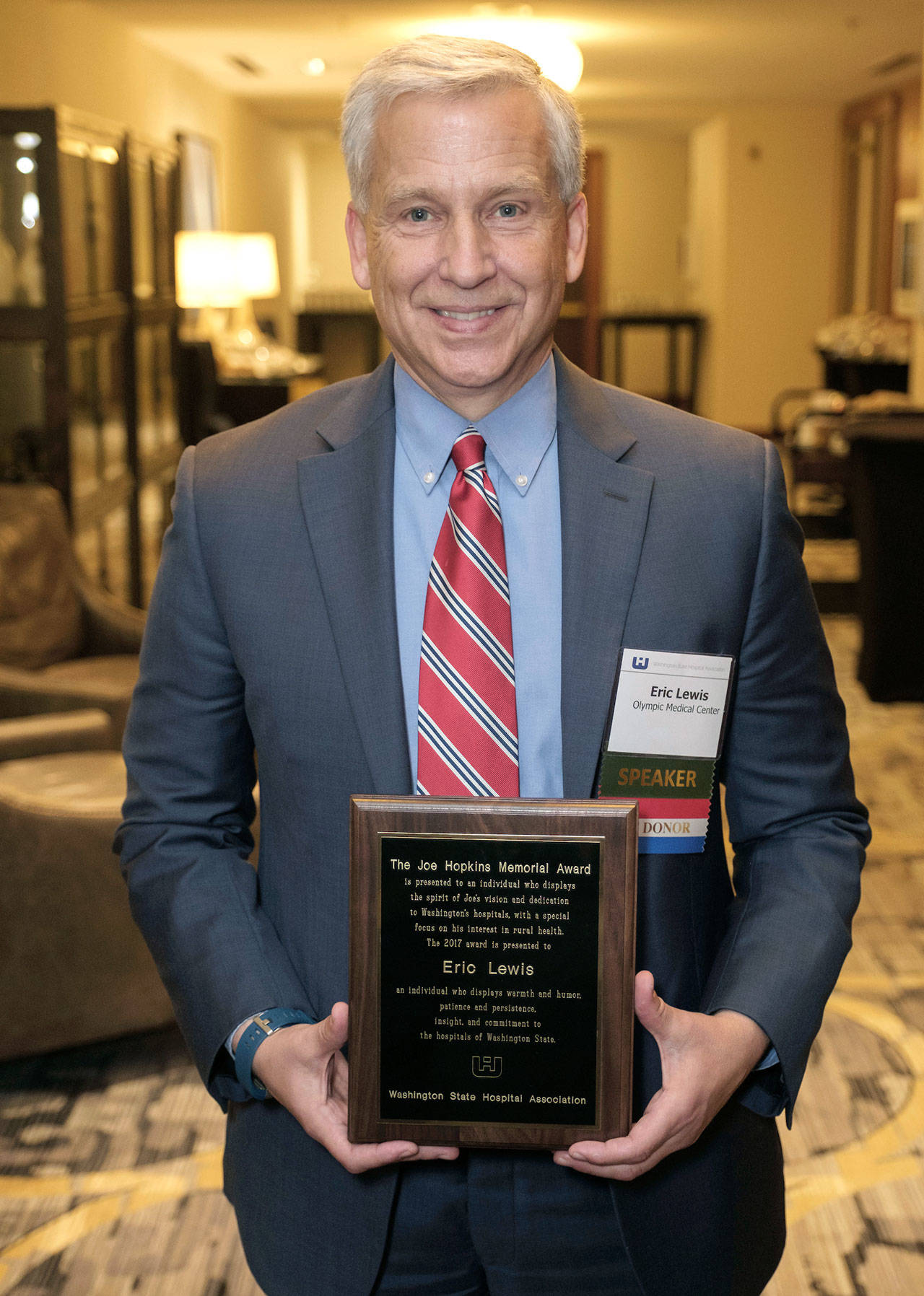 The Washington State Hospital Association presented Eric Lewis, CEO of Olympic Medical Center, with the Joe Hopkins Memorial Award on Oct 12. (Bobby Beeman)
