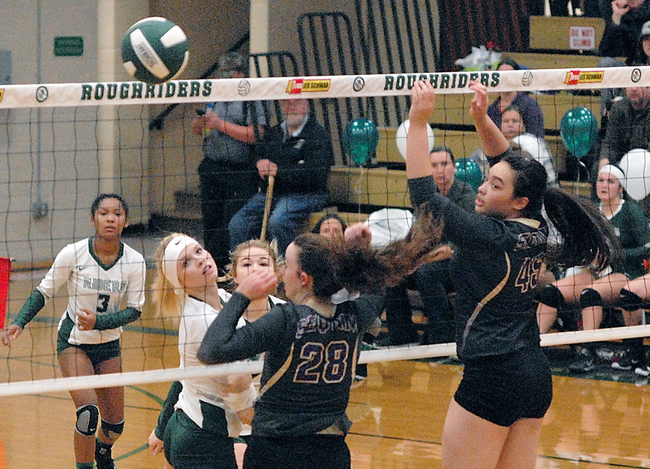 Keith Thorpe/Peninsula Daily News Port Angeles&rsquo; Natalie Steinman, second from left, watches after tapping the ball over the net as Sequim&rsquo;s Tayler Breckenridge, center, and Lindsey Leader, right, look on during the first game of Thursday night&rsquo;s match at Port Angeles High School. Looking on were Port Angeles&rsquo; Lannie Lyambna, left, and Hailee Hugdahl.