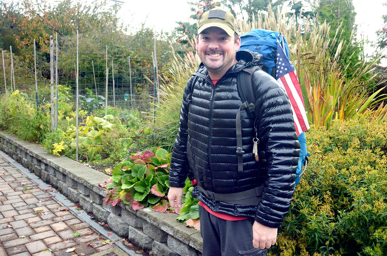 Eli Smith, a veteran from Ohio, has spent almost a year hiking from Florida to California and up to Washington in an effort to walk to the four corners of the United States to raise awareness for veteran suicide and PTSD. (Cydney McFarland/Peninsula Daily News)