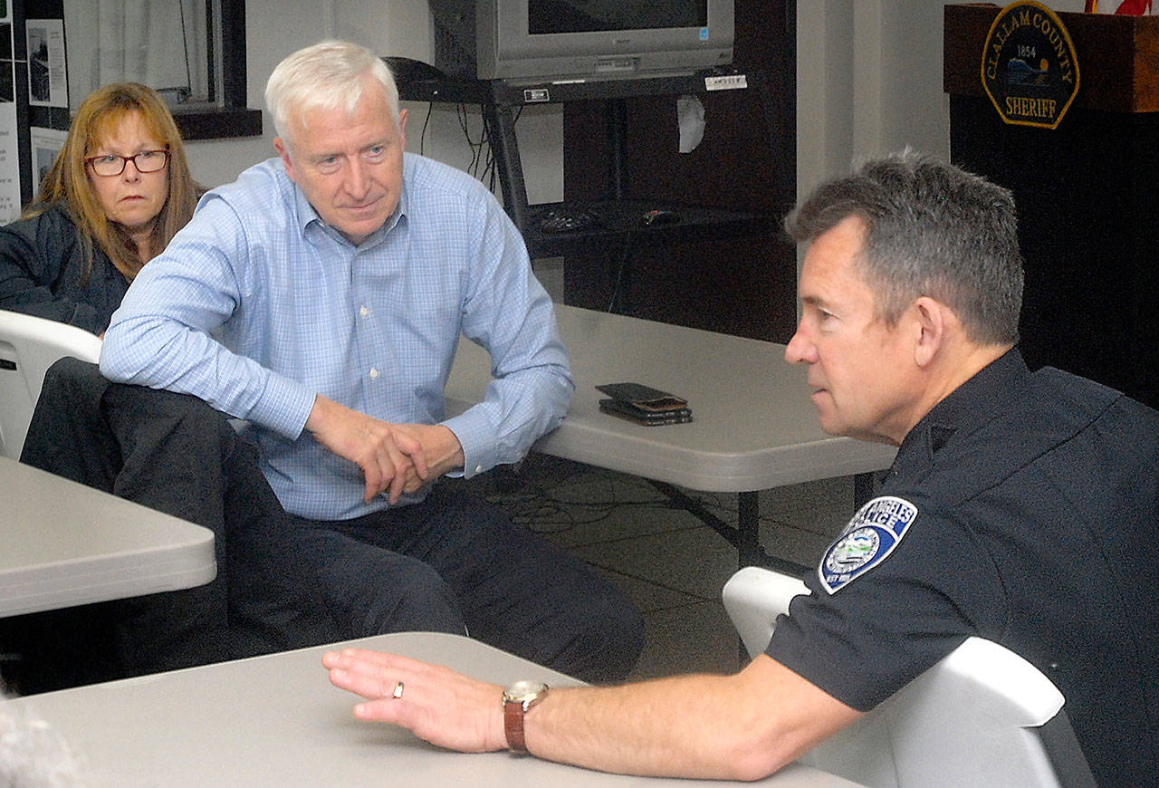 Port Angeles Police Chief Brian Smith, right, discuses safety concerns of the city in a meeting with Nancy Bickford, an aide to the state adjutant general, left, and Washington State Emergency Management Director Robert Ezelle during a meeting with area officials Friday at the Clallam County Courthouse in Port Angeles. (Keith Thorpe/Peninsula Daily News)
