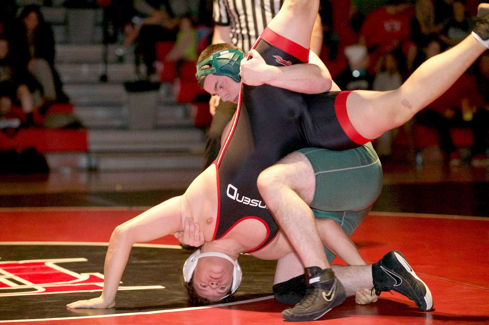 Port Angeles' Kyle La Fritz defeats Port Townsend's Jacob Massie in the 220-pound weight class during the double dual meet between Port Angeles