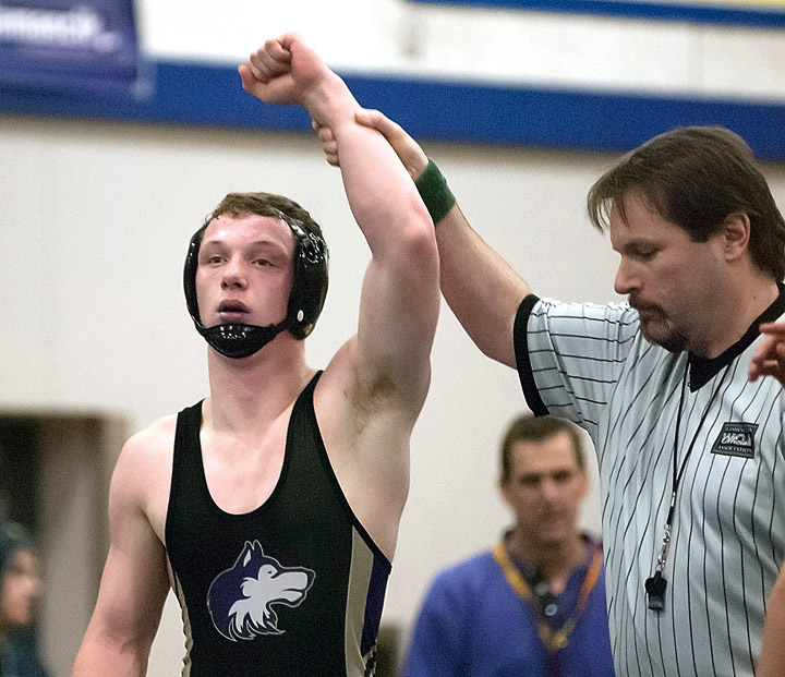Sequim's Kevyn Ward is declared the winner after a regional tournament victory. Ward will compete in his second Mat Classic starting today at the Tacoma Dome. (Chris Tucker/Central Kitsap Reporter)