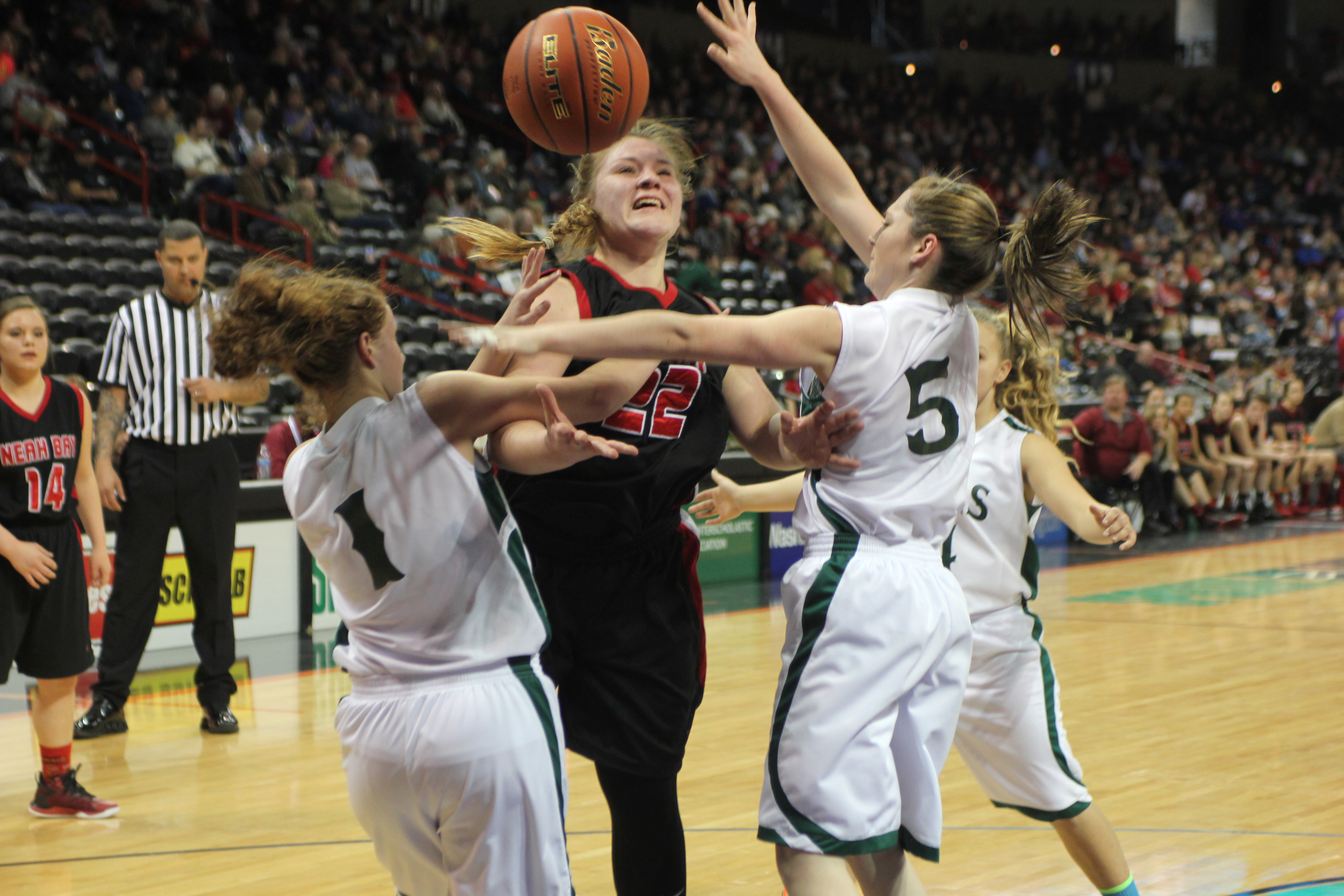 Neah Bay's Faye Chartraw is fouled by Mary M. Knight's Jaycee Valley