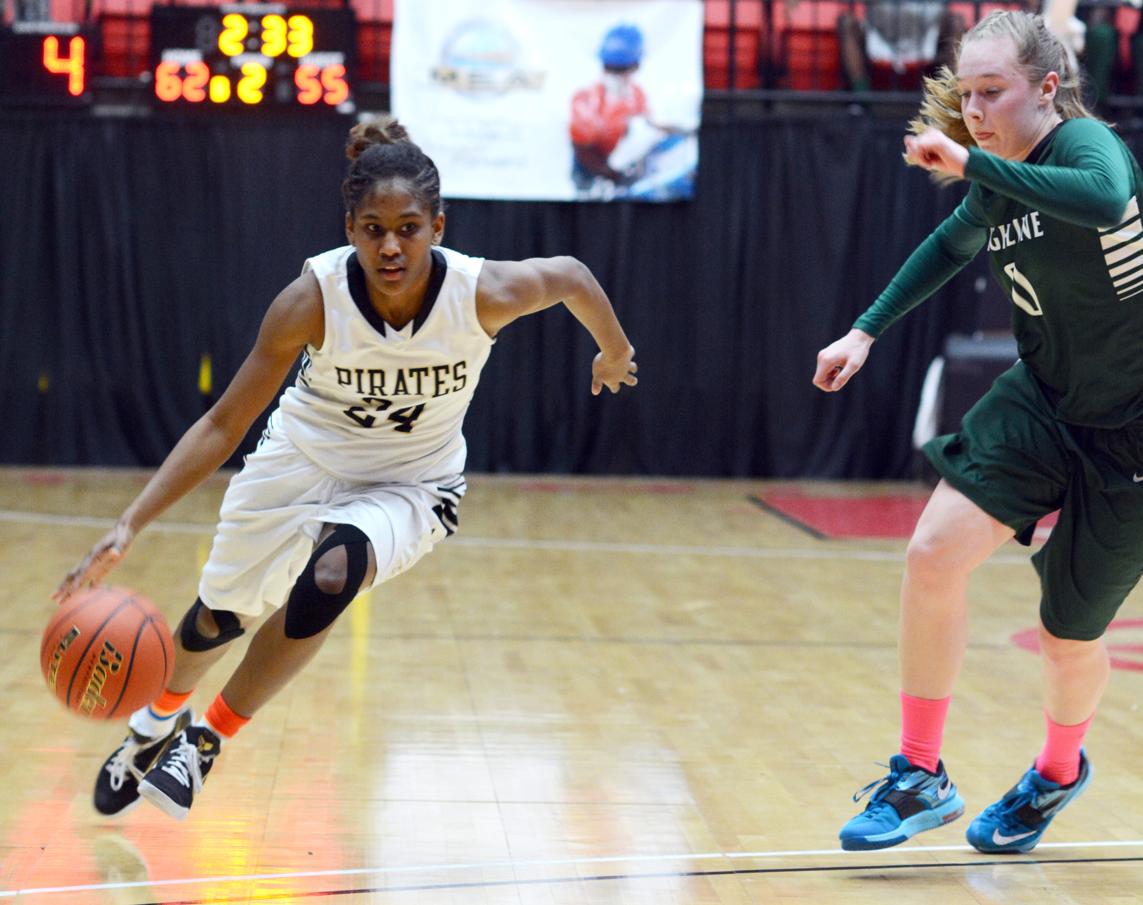 Peninsula point guard Imani Smith speeds past Alyson Rippingham during the Pirates' 69-55 win in the NWAC tournament quarterfinals. Smith led Peninsula with 20 points. (Rick Ross)