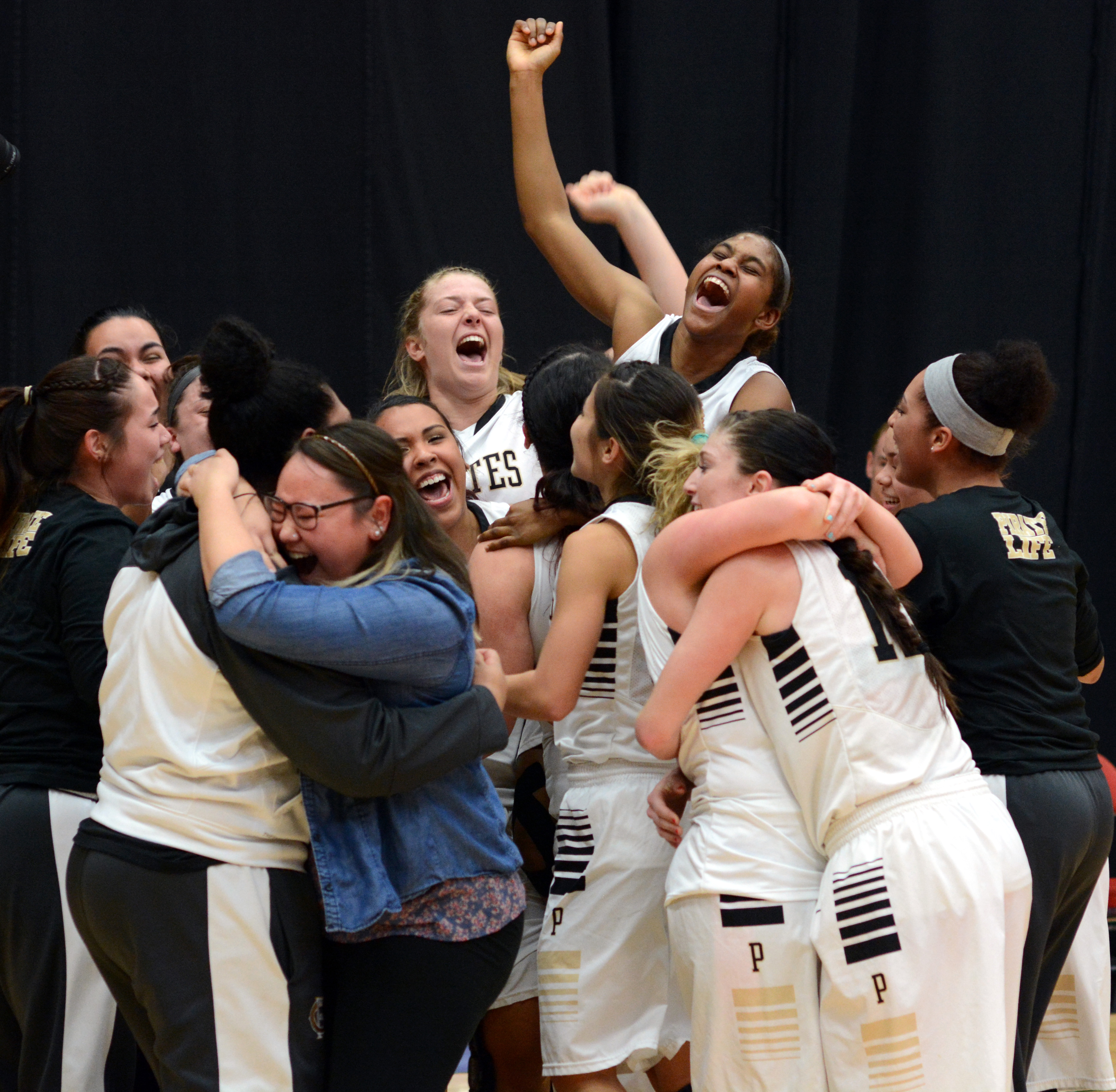 The Peninsula College women's basketball team celebrates winning the Northwest Athletic Conference championship Tuesday in Kennewick. (Rick Ross/Peninsula College)