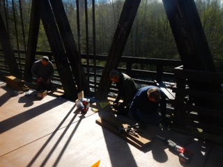Peninsula Trails Coalition volunteers work on the Railroad Bridge
